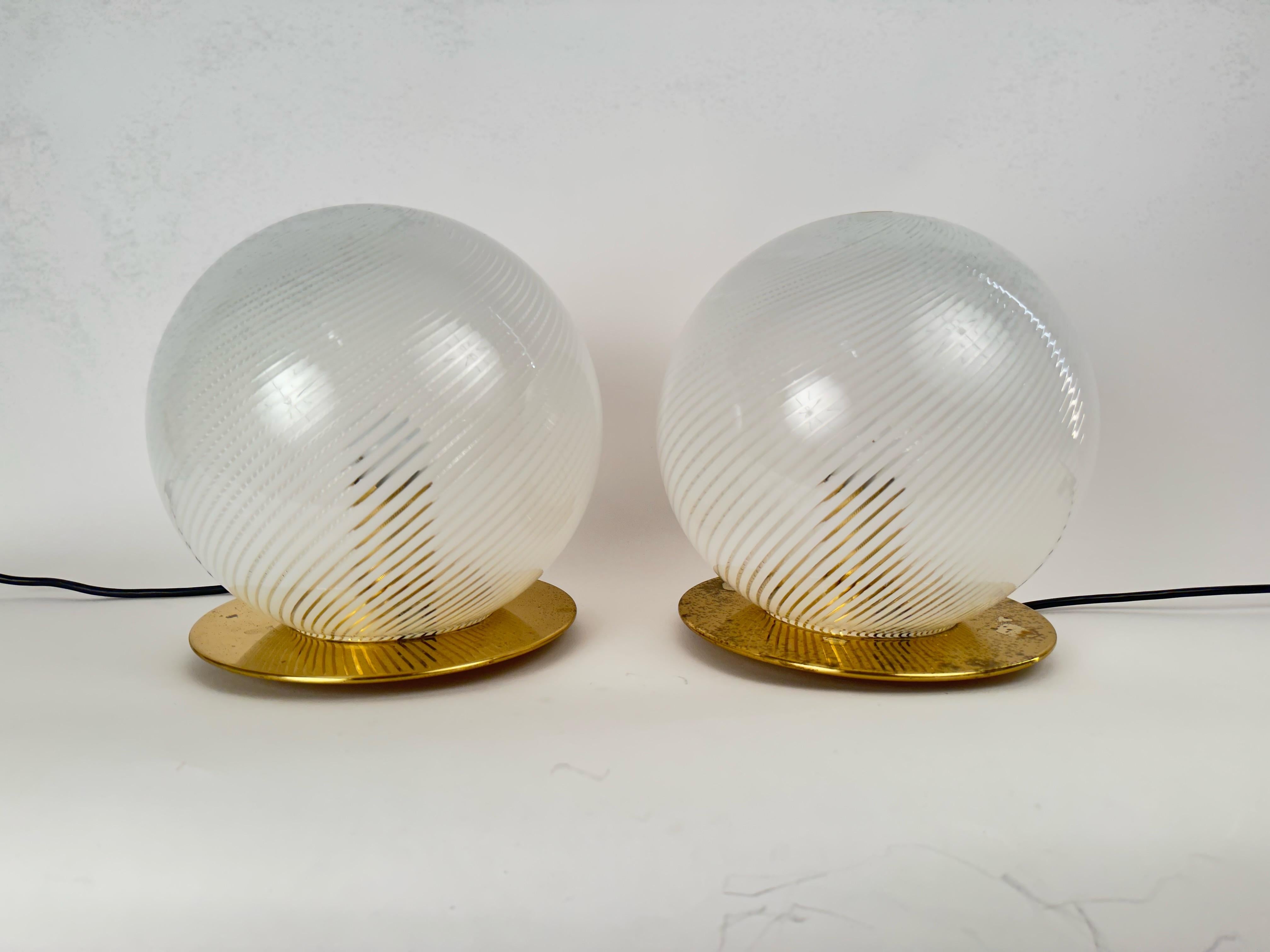 Two 1960s Italian table lamps with striated drawings.edited by Murano.Stamped 