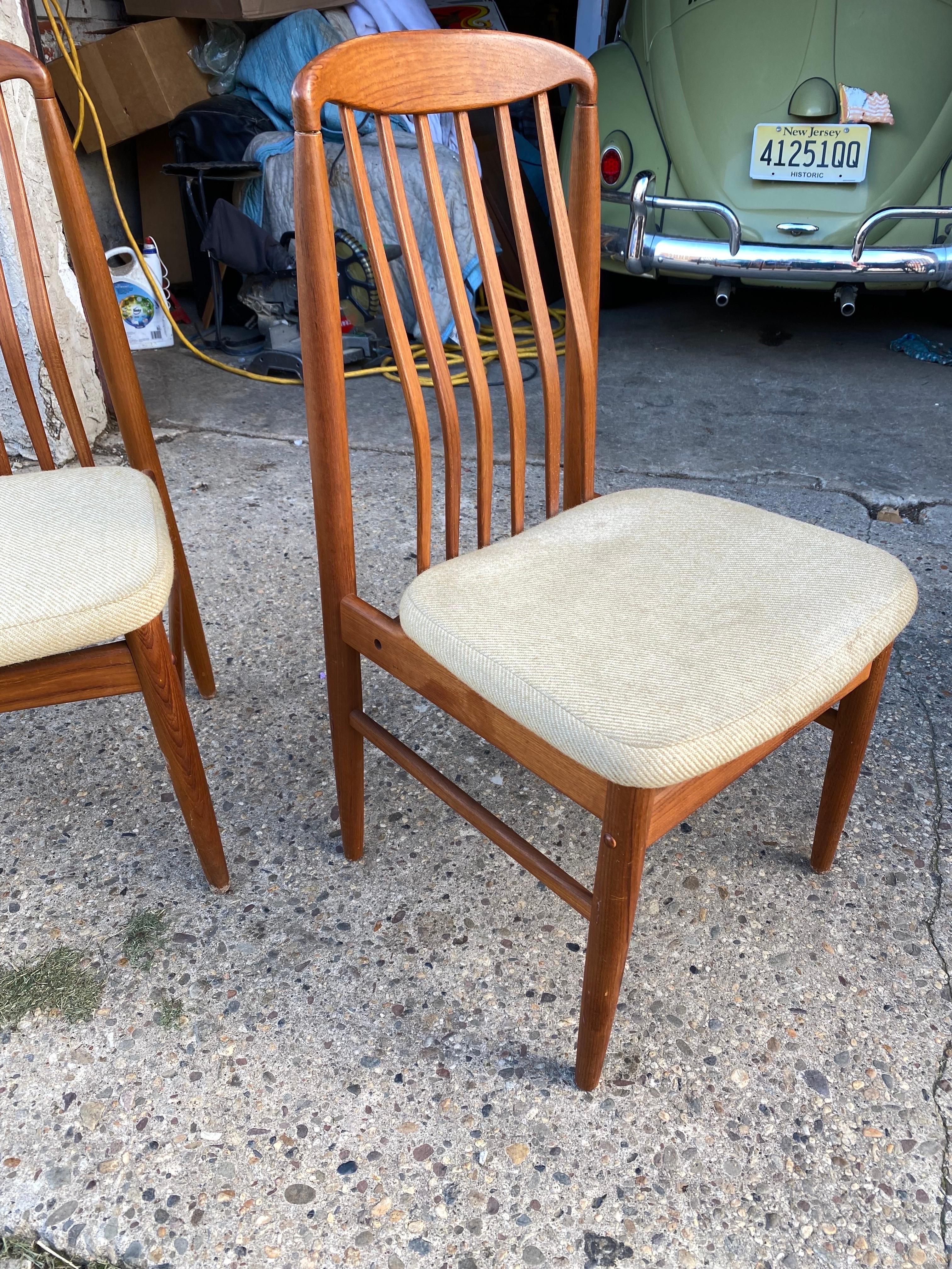 Pair of Benny Linden Teak Dining Chairs with Upholstered Seats.  Perfect to add to your existing set or use with a desk!  Seats show wear, but wood is very nice.  Couple wood buttons missing.