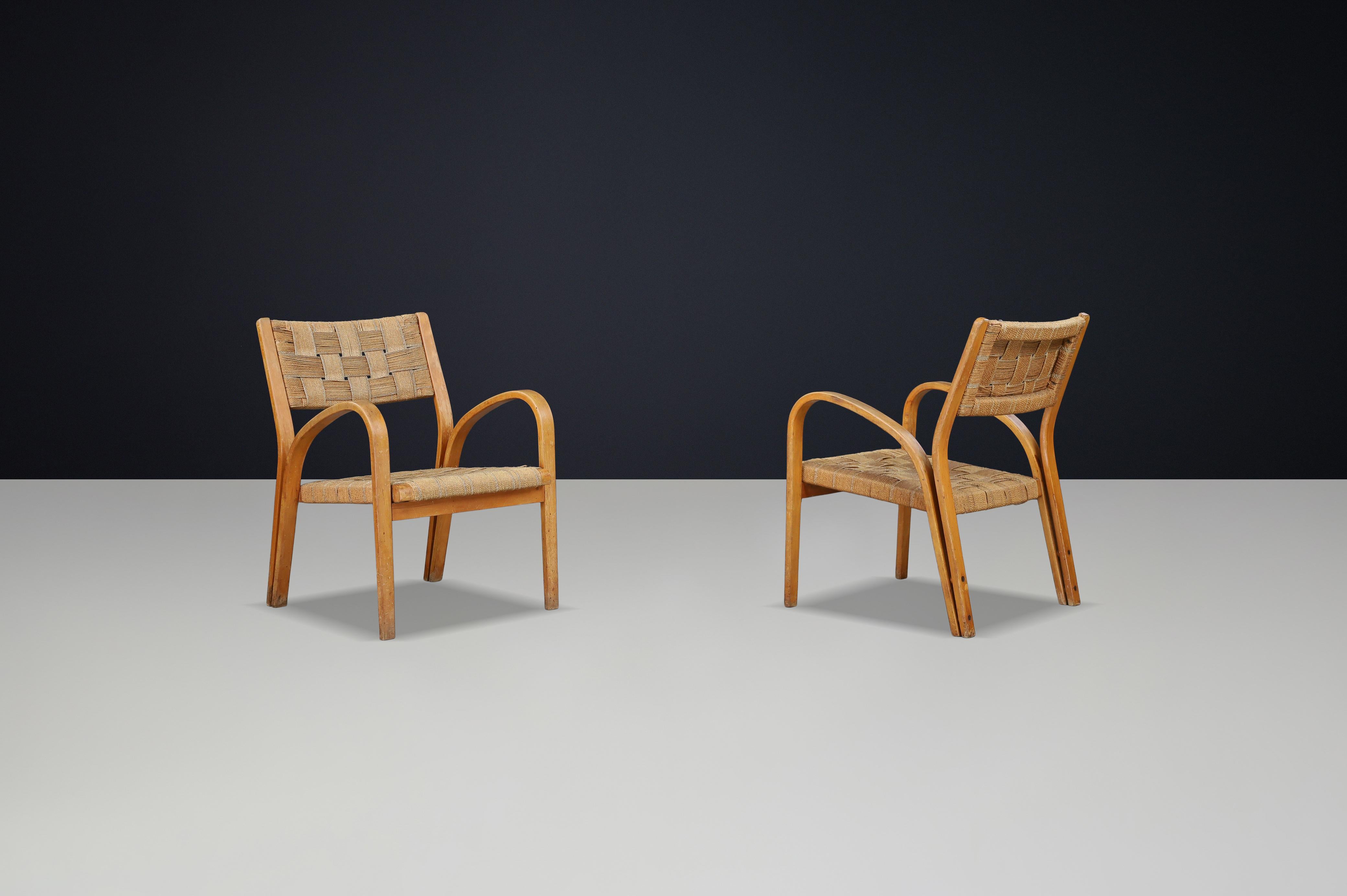Mid-Century moderno Coppia di poltrone in compensato curvato e corda intrecciata di Augusto Romano, Italia, anni '40