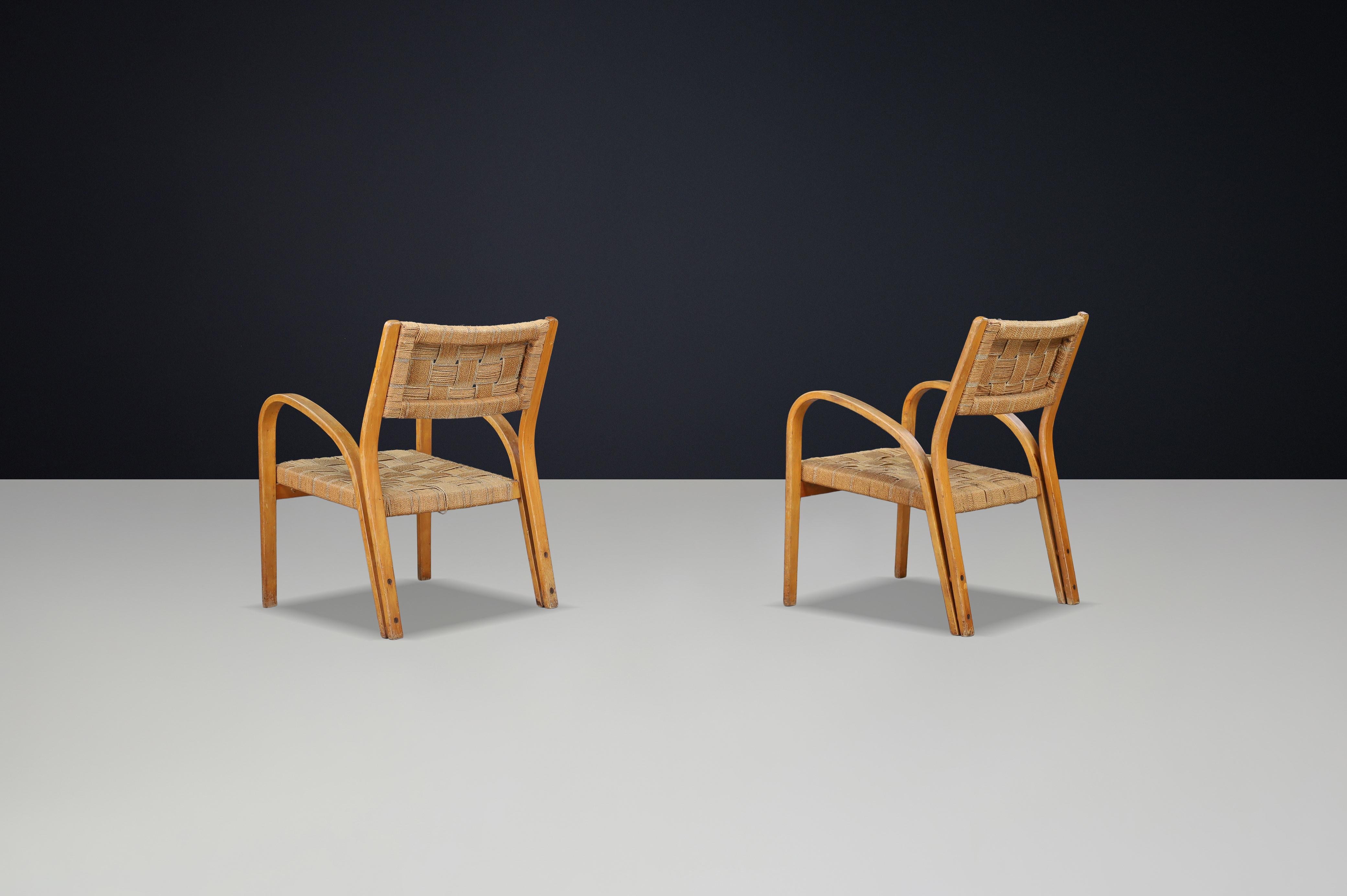 XX secolo Coppia di poltrone in compensato curvato e corda intrecciata di Augusto Romano, Italia, anni '40