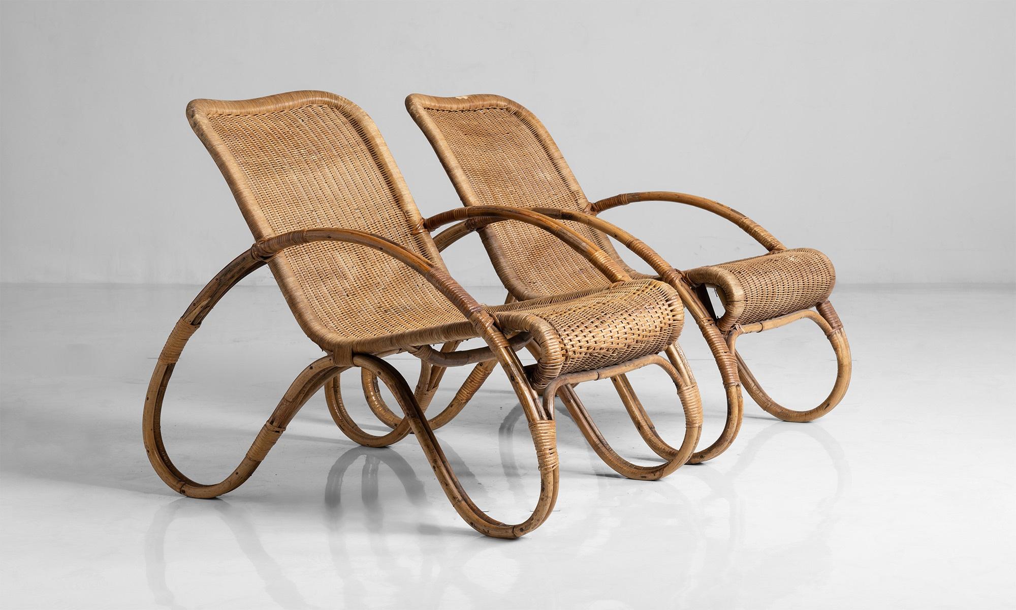 Bentwood armchairs with dynamic form, wicker seat and back.