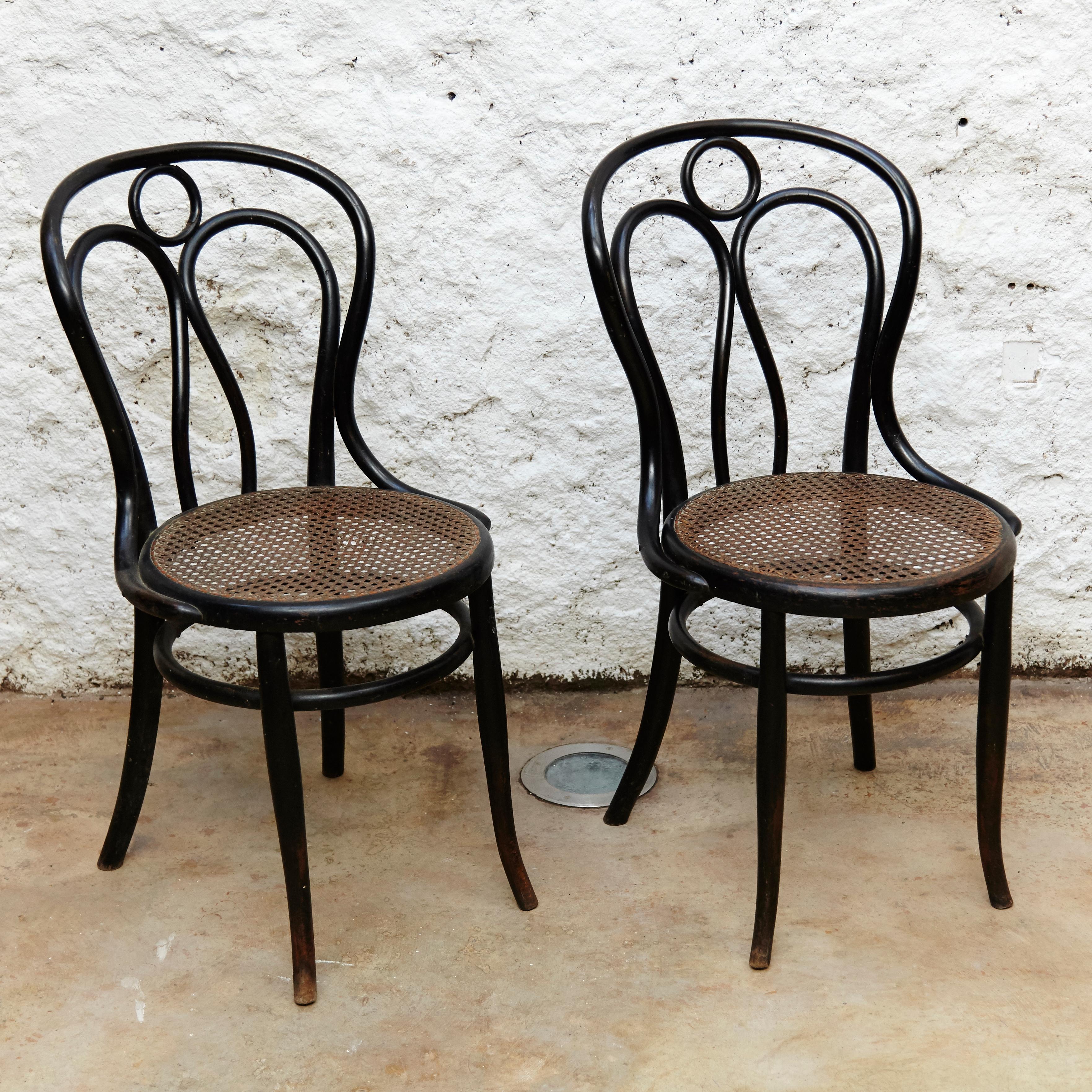 Hofman bentwood pair of chairs, circa 1900, Austria 

In original condition, with minor wear consistent with age and use, preserving a beautiful patina. One of the seats is a bit damaged.

Bentwood and rattan.