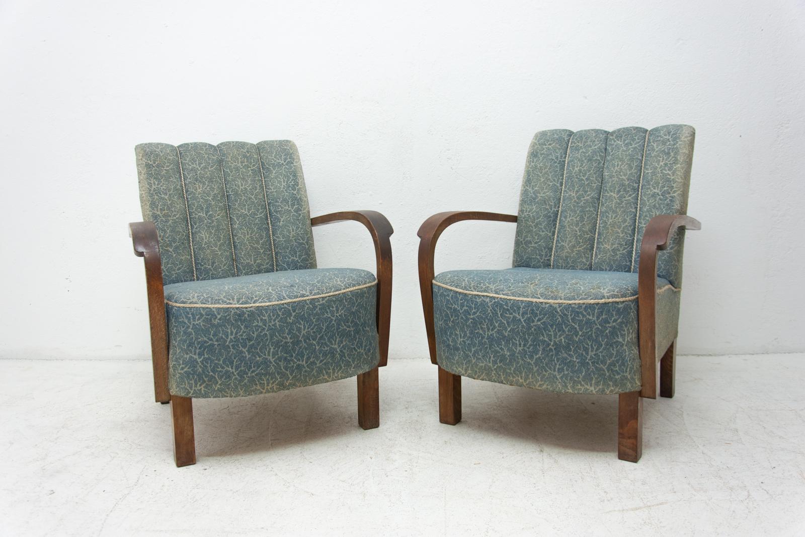 These bentwood armchairs Cataloque No. were designed by Jindrich Halabala and produced by UP Závody in the 1930s. The chairs are stable and comfortable. The structure and upholstery are in good preserved condition, the fabric is faded in places. See