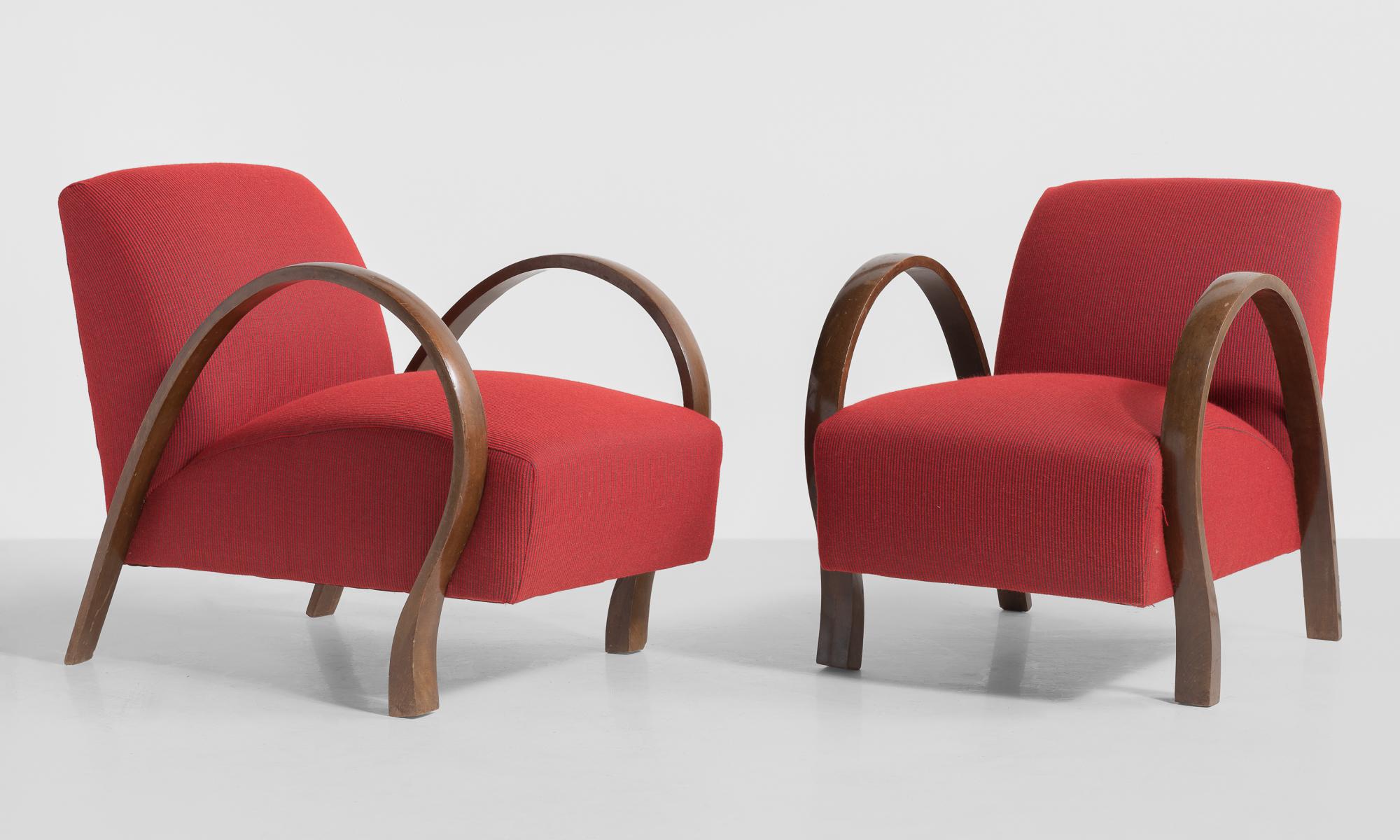 Pair of modern bentwood armchairs, Italy, circa 1930.

Bentwood arms with unique form. Newly reupholstered in Garnet color Wool Rib fabric by Maharam. 

Measures: 22.25” W x 31.5” D x 28” H x 16” seat.