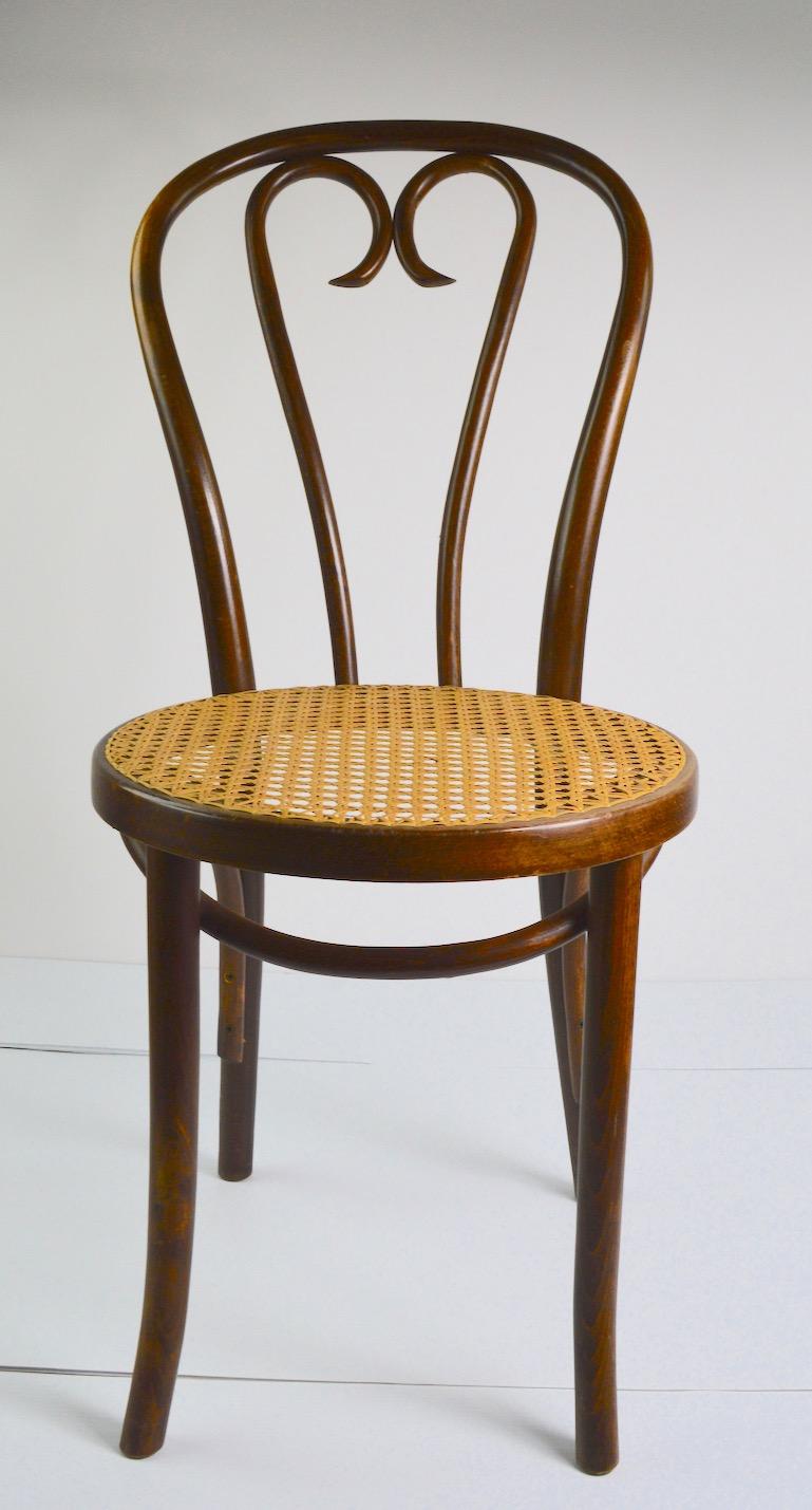 Clean ready to use pair of bentwood cafe dining chairs attributed to Thonet. Priced and offered individually, but we would love to see them stay together.