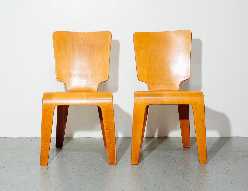 Pair of bent plywood dining chairs by Thaden Jordan, 1940s. Contemporary of the bent plywood Eames designs of the time, these chairs by Thaden Jordan epitomize post-war technology and design. Signed.
