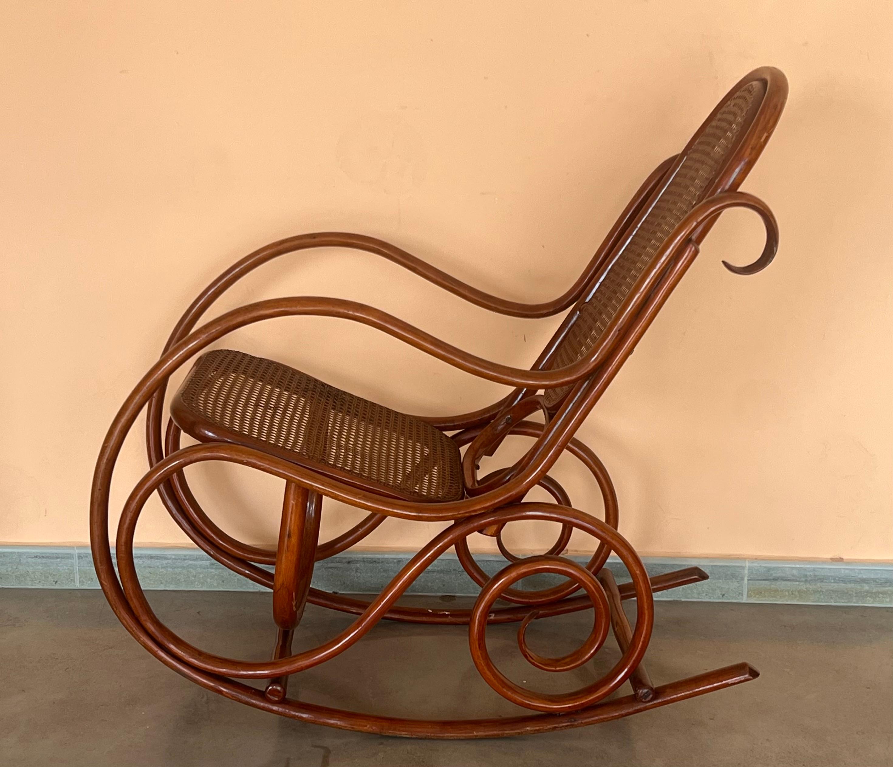 Art Nouveau Pair of Bentwood Rocking Chairs with Cane Seat and Back For Sale