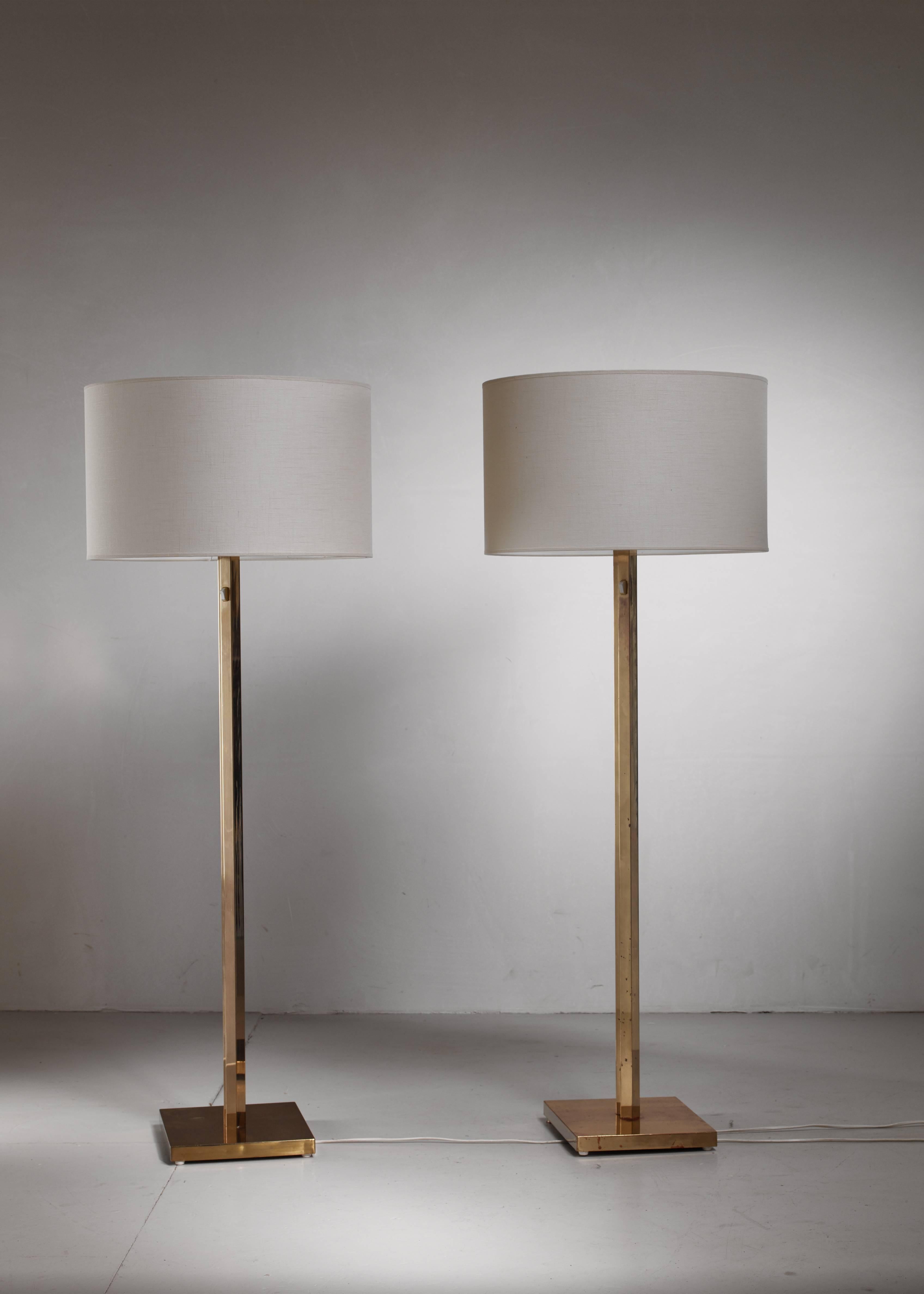 A pair of brass floor lamps by Bergboms, Sweden. The stem has an interesting shape, made of two square stems, connecting at the corners. Light switch at the top of the stem.

Labeled by Bergboms and age related wear on the stems. The measurements