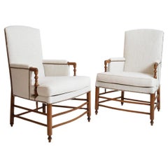 Pair of bergère armchairs, 1950s.