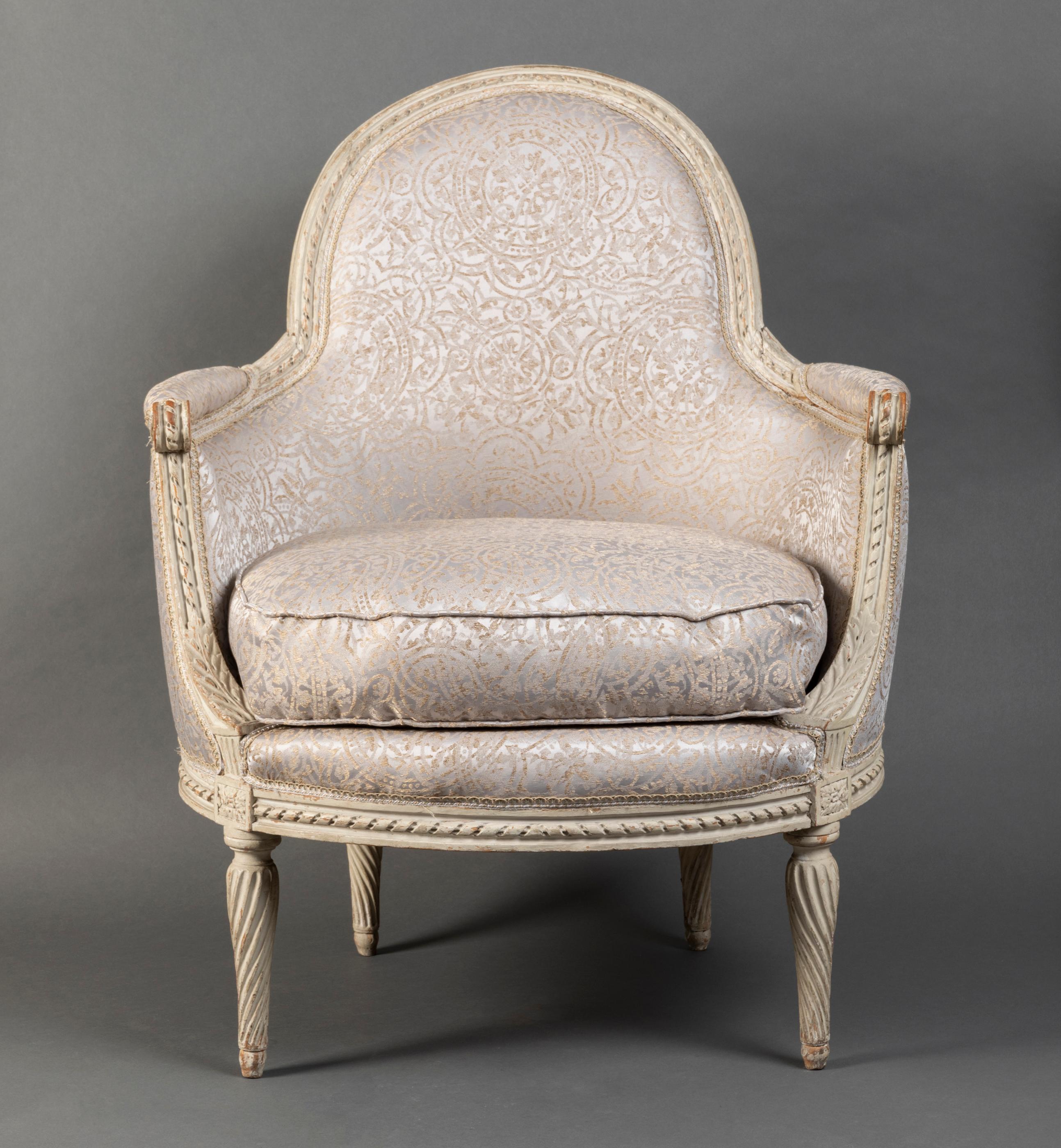 Beautiful pair of wing chairs in molded beech, richly carved and cream lacquered, decorated by banded moldings; enveloping armrest consoles with stylized acanthus leaves and rosettes; tapered legs with twisted grooves.
DELANOIS stamp on the two