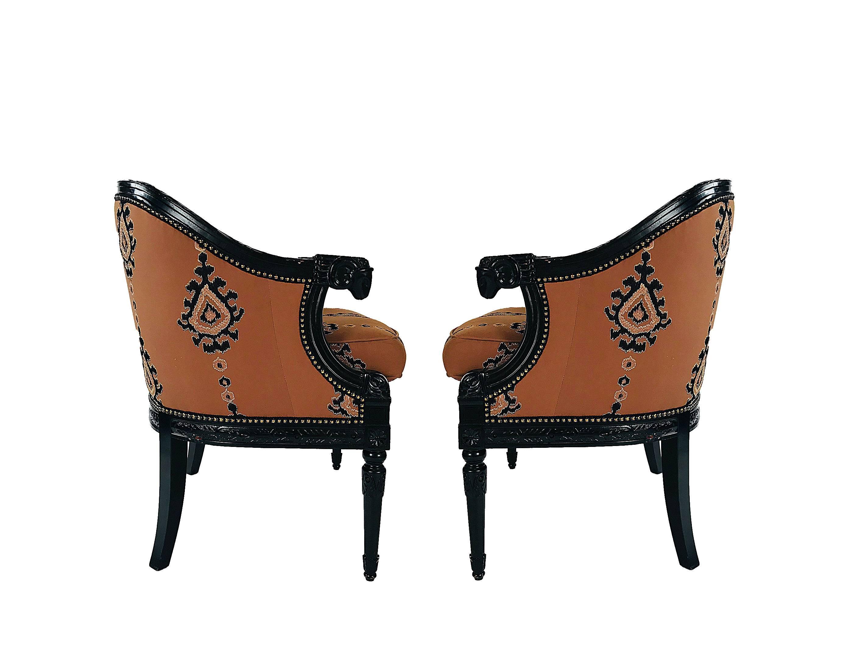 Louis XVI Pair of Bergere chairs with carved ram head arms