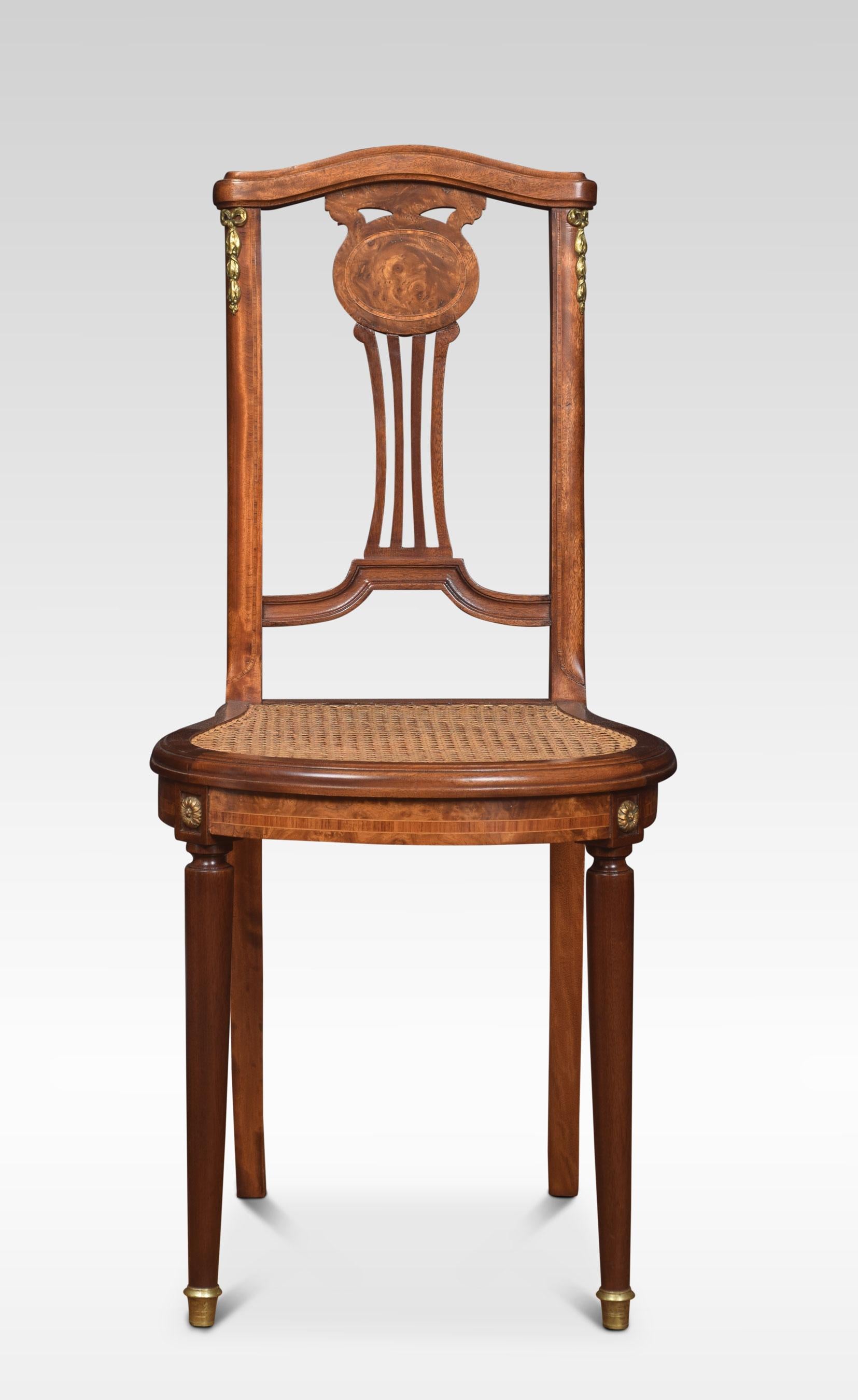 Pair of bergere side chairs, the shaped top rail above inlaid splat back to the inset berger seats. All raised up on fluted front legs terminating in brass feet.
Dimensions
Height 36.5 Inches height to seat 18 Inches
Width 16 Inches
Depth 17