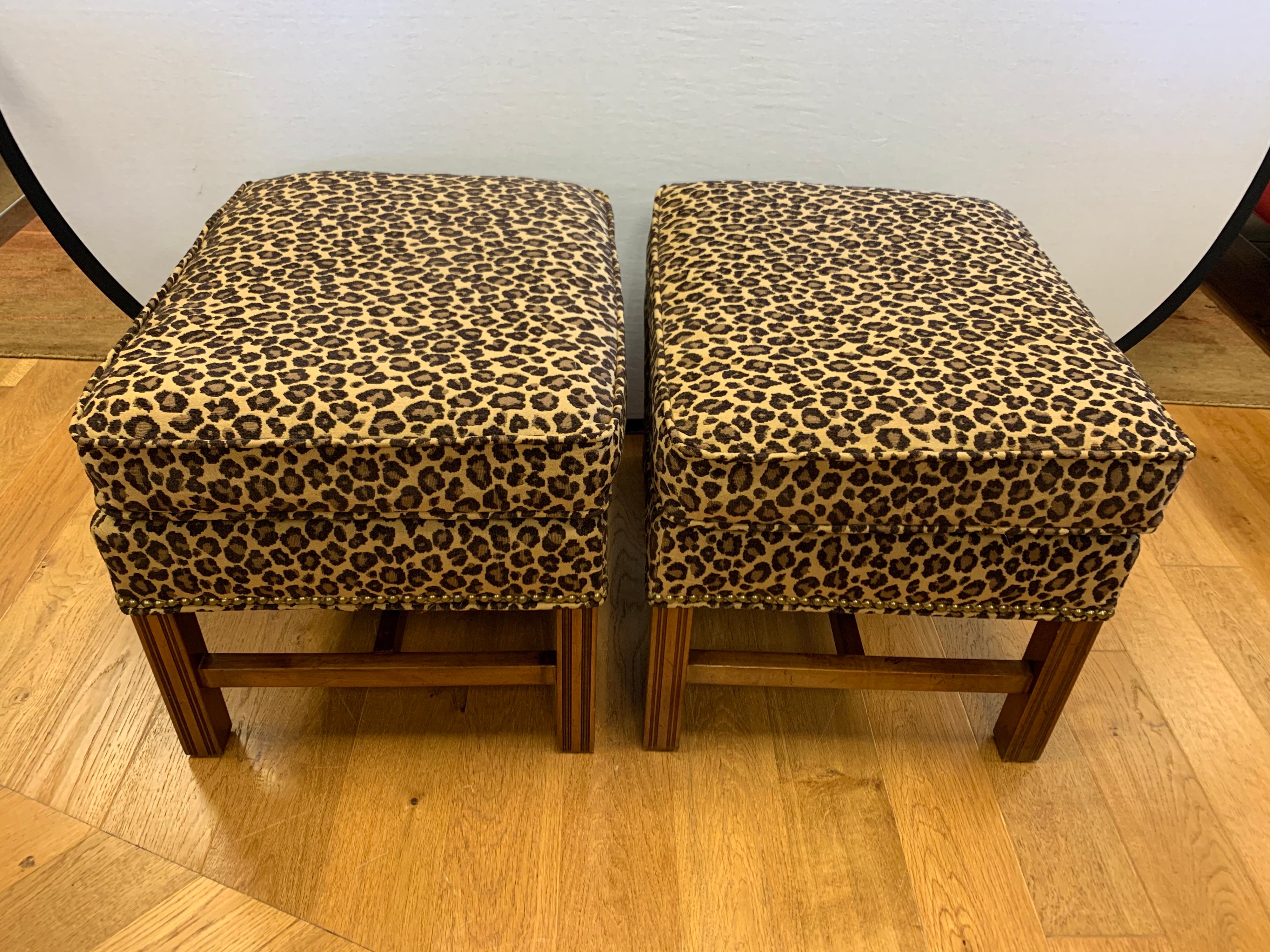 Elegant, newly upholstered in leopard print ottomans poufs with nailheads all around.
The manufacturer is Bernhardt Furniture. Made in the USA. Great scale, not too big, not
too small.