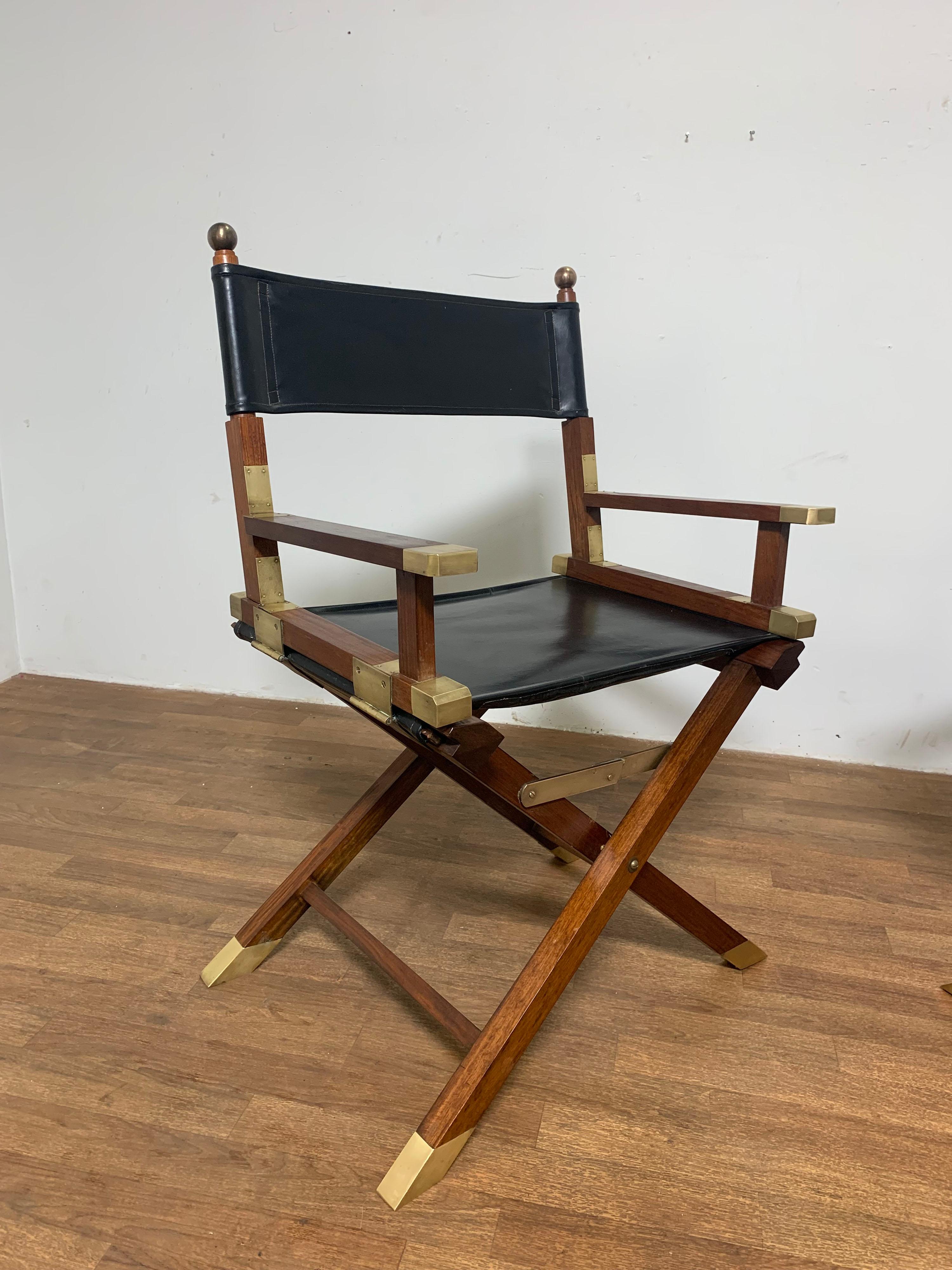 A bespoke pair of campaign chairs in rosewood and brass by the renowned Hong Kong antiques dealer Charlotte Horstmann, circa 1950s.