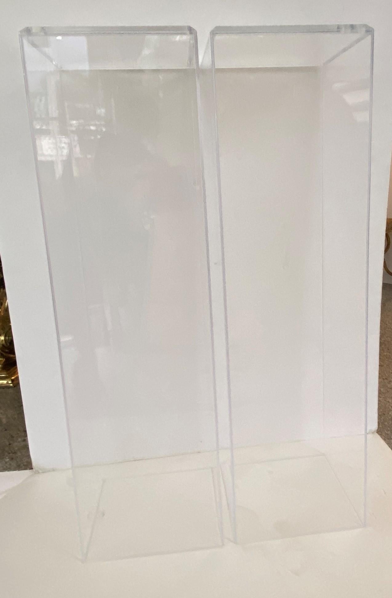 This stylish, clean-lined design for a pair of lucite pedestals will make the perfect perch for your artwork or sculpture.

Note: Top surface are measures 11.25 width x 11.25