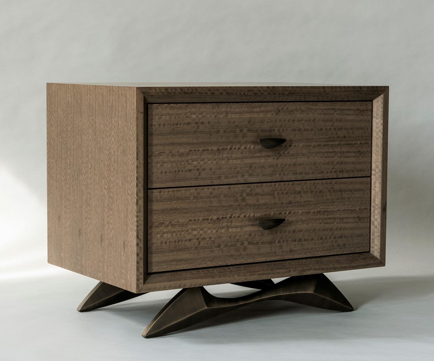 Designed as an exploration of equilibrium, the sculptural base of the Bevel Bedside Table appears to float on it's many facets. Appearing at once delicate and sturdy, the carefully balanced base supports dual drawers above.

This pair is in stock