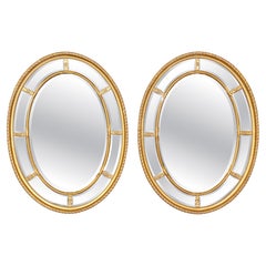 Pair of Beveled Glass Oval Neoclassical Style Gilded Mirrors