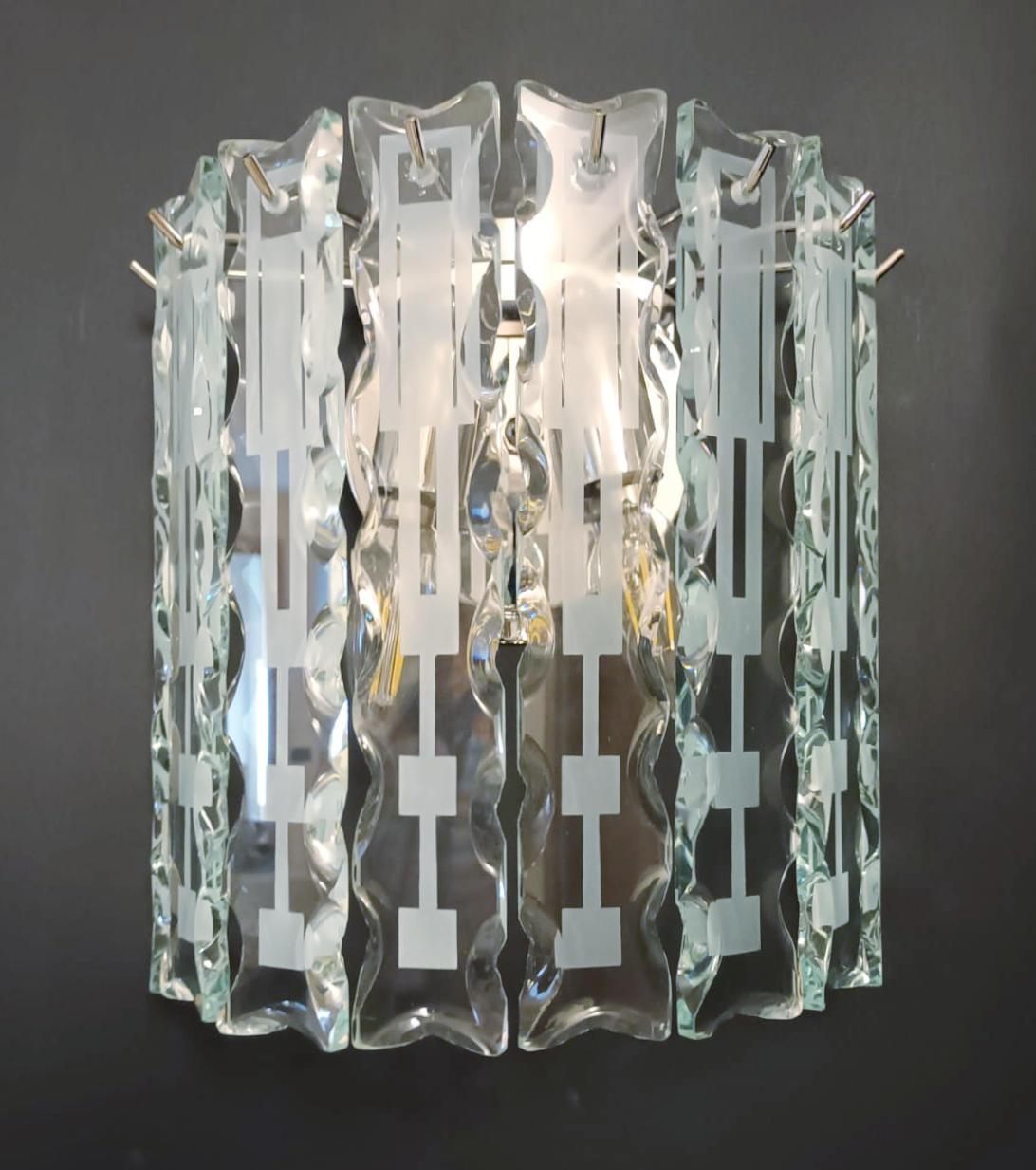 Vintage Italian wall sconces with deco beveled glass bars mounted on chrome frames / Made in Italy by Cristal Arte, circa 1960s
2 lights / E12 or E14 type / max 40W each
Measures: height 10 inches, width 10 inches, depth 5 inches
3 pairs in stock in