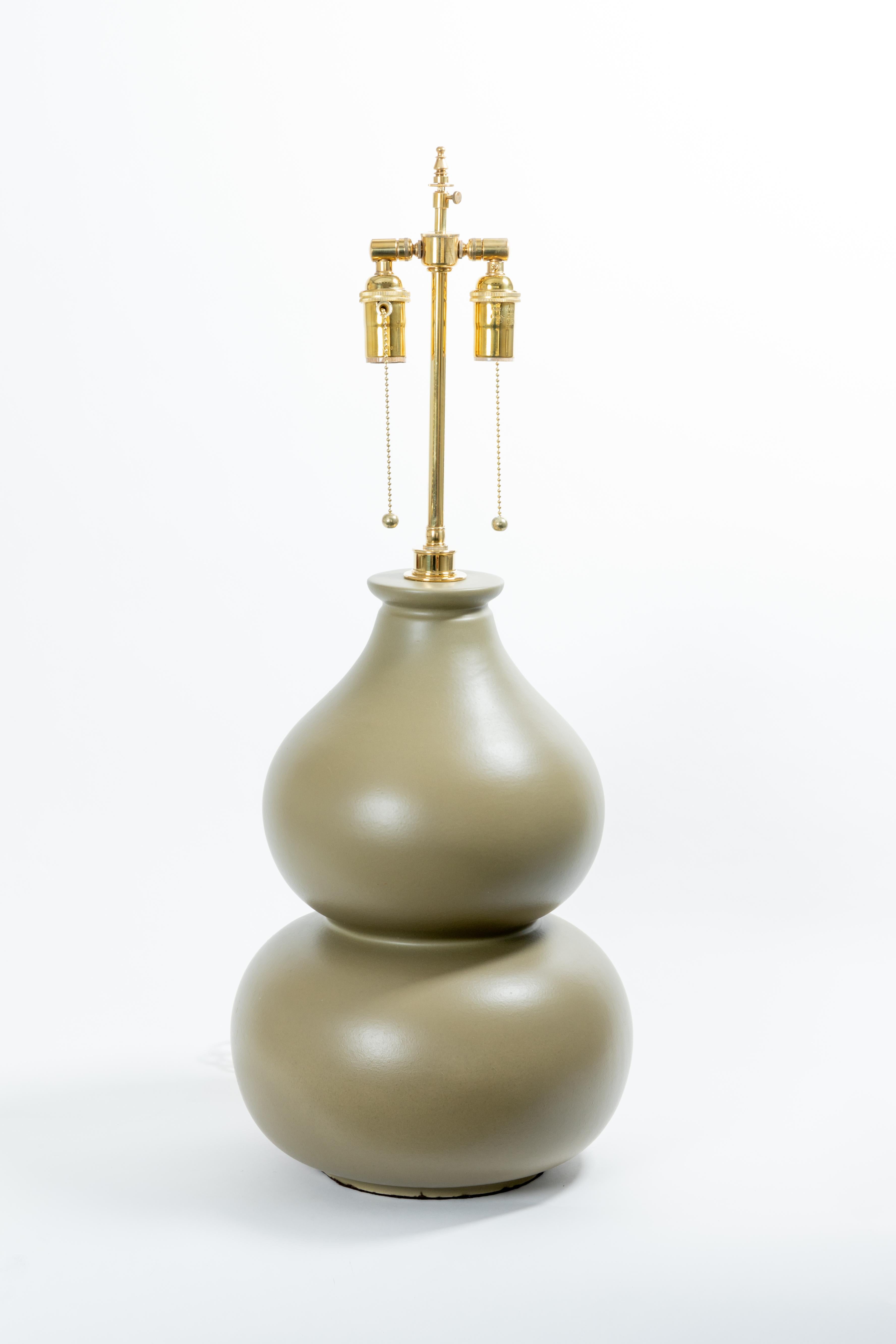 Pair of grey gourd form ceramic table lamps.  Pale green pair sold.