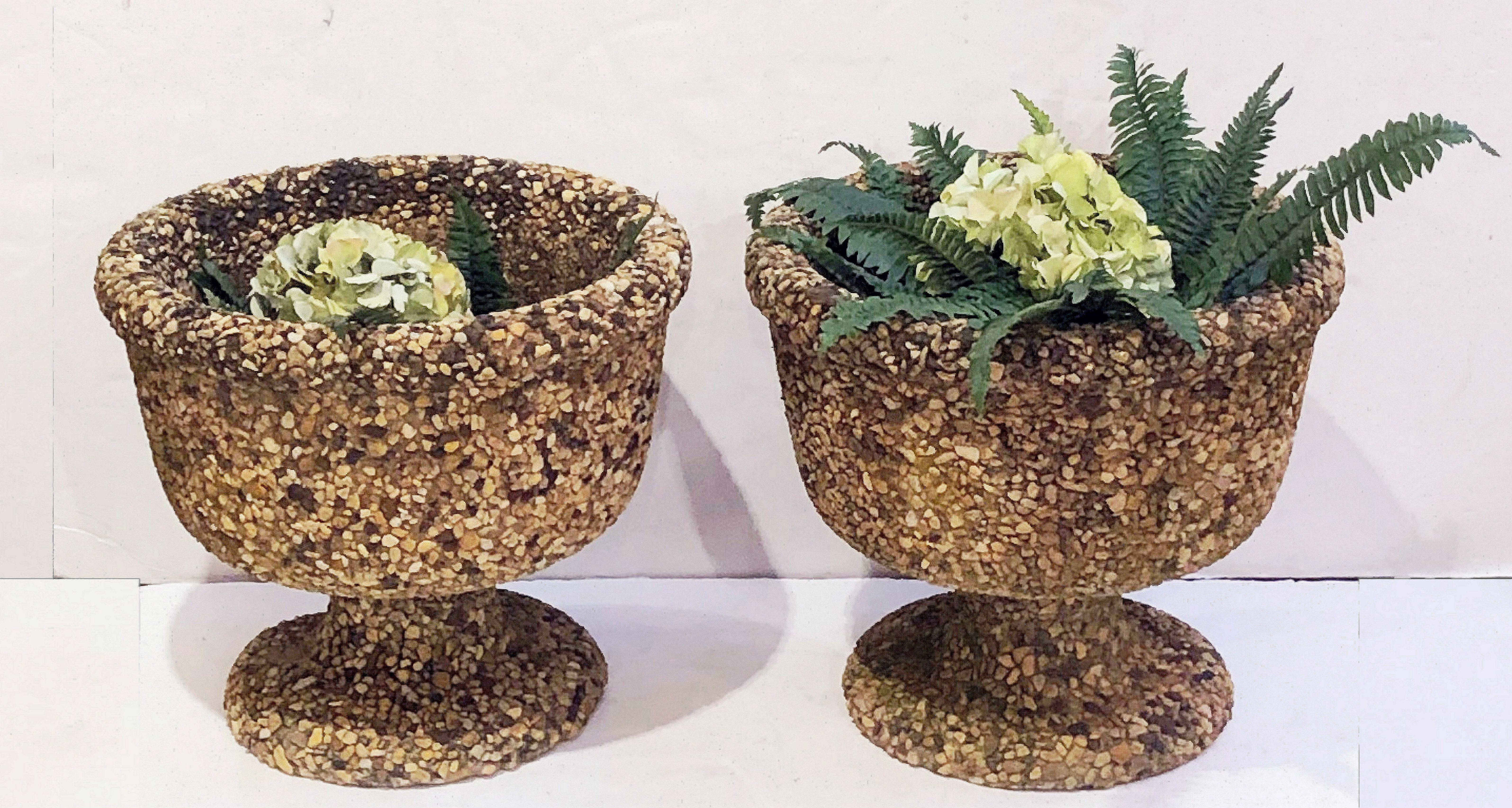 A fine pair of Biarritz garden urns or planters with pebble inlay, from the elegant seaside town on France's southwestern Basque coast.
Each urn featuring a round bowl over a circular footed base.

Dimensions: Height 17 inches x diameter 20
