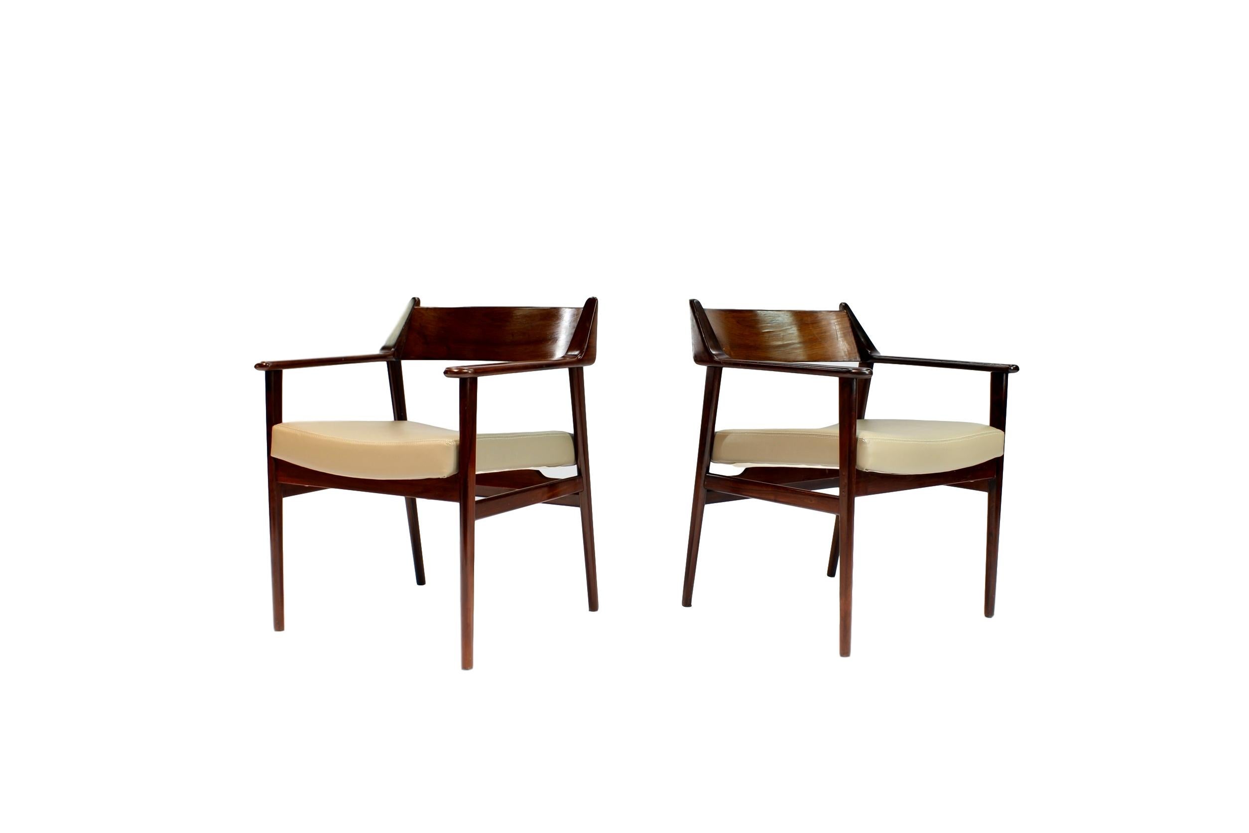 A pair of 'Poltrona Bicuda' chairs, circa 1960
Solid rosewood with leather seats.

P.S. Colors may vary.
       Buyer Pays Shipping Cost.