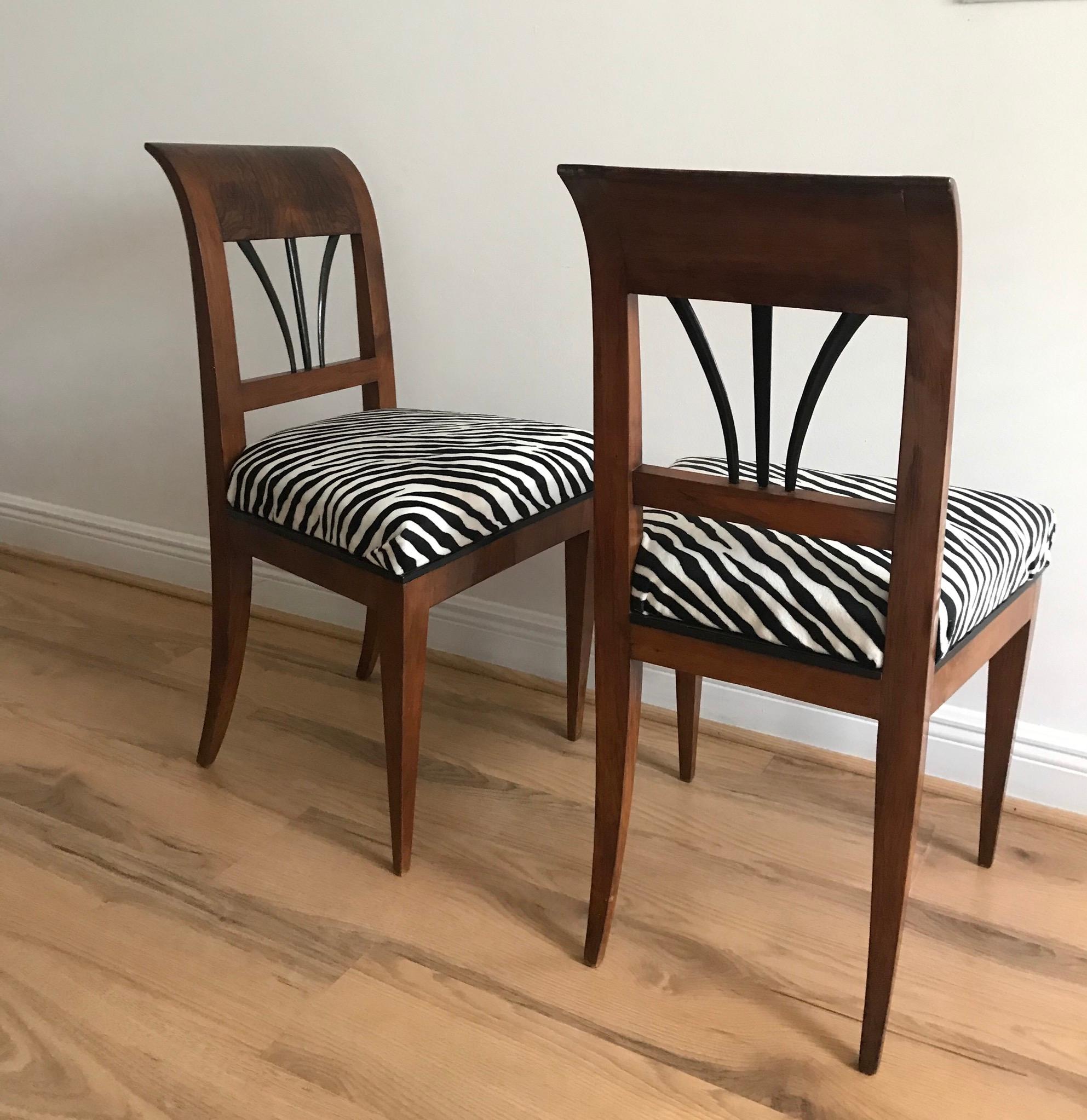 Elegant pair of 1820 Viennese Biedermeier walnut veneer chairs in chenille zebra textile.