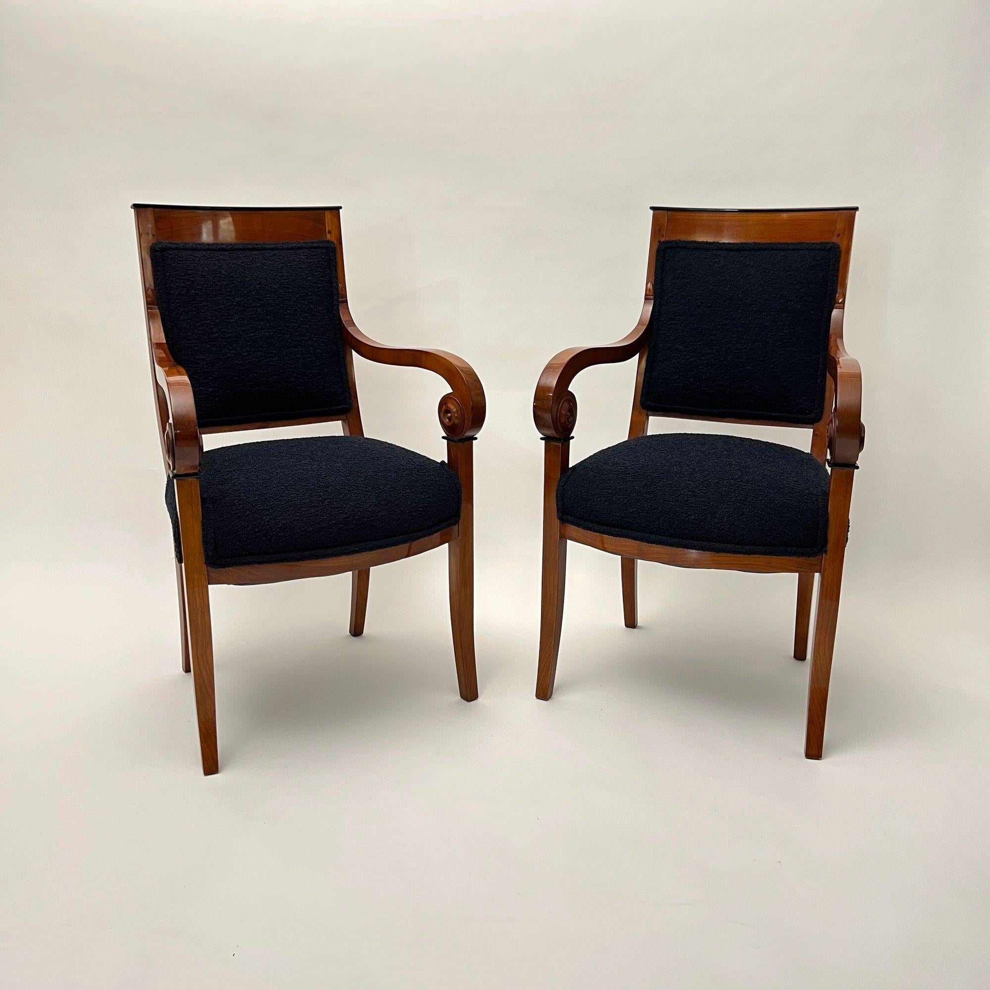French Pair of Biedermeier Armchairs, Cherry Wood, Black Boucle, France circa 1820 For Sale