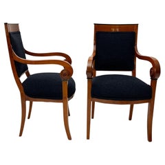 Paire de fauteuils Biedermeier, bois de cerisier, bouclette noire, France, circa 1820