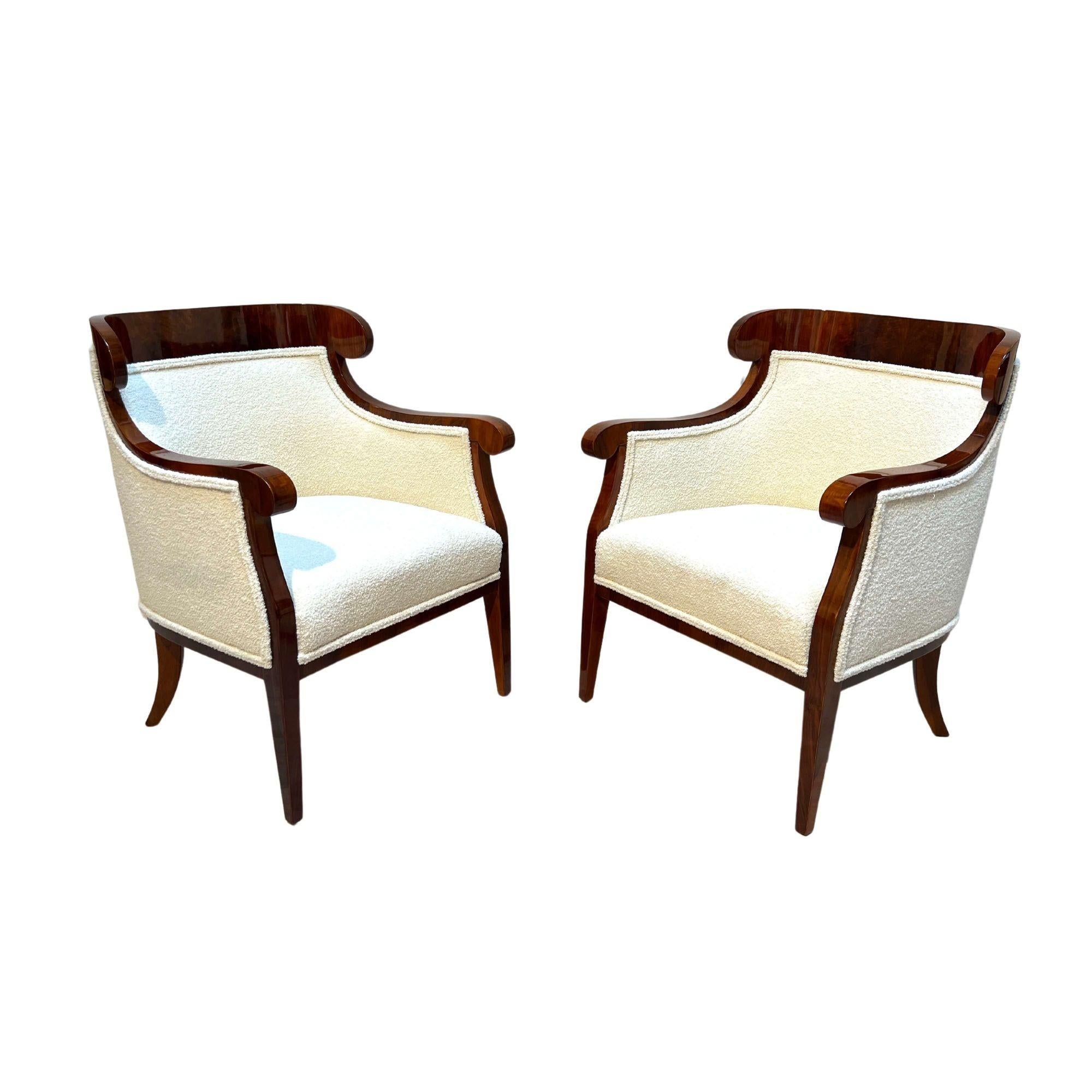 Beautiful pair of Biedermeier Bergeres or Bergere chairs from Austria around 1860.
Walnut veneered and solid wood. Restored and hand polished with shellac. Conical square tapered legs. Newly upholstered with cream-white boucle fabric.
Dimensions: