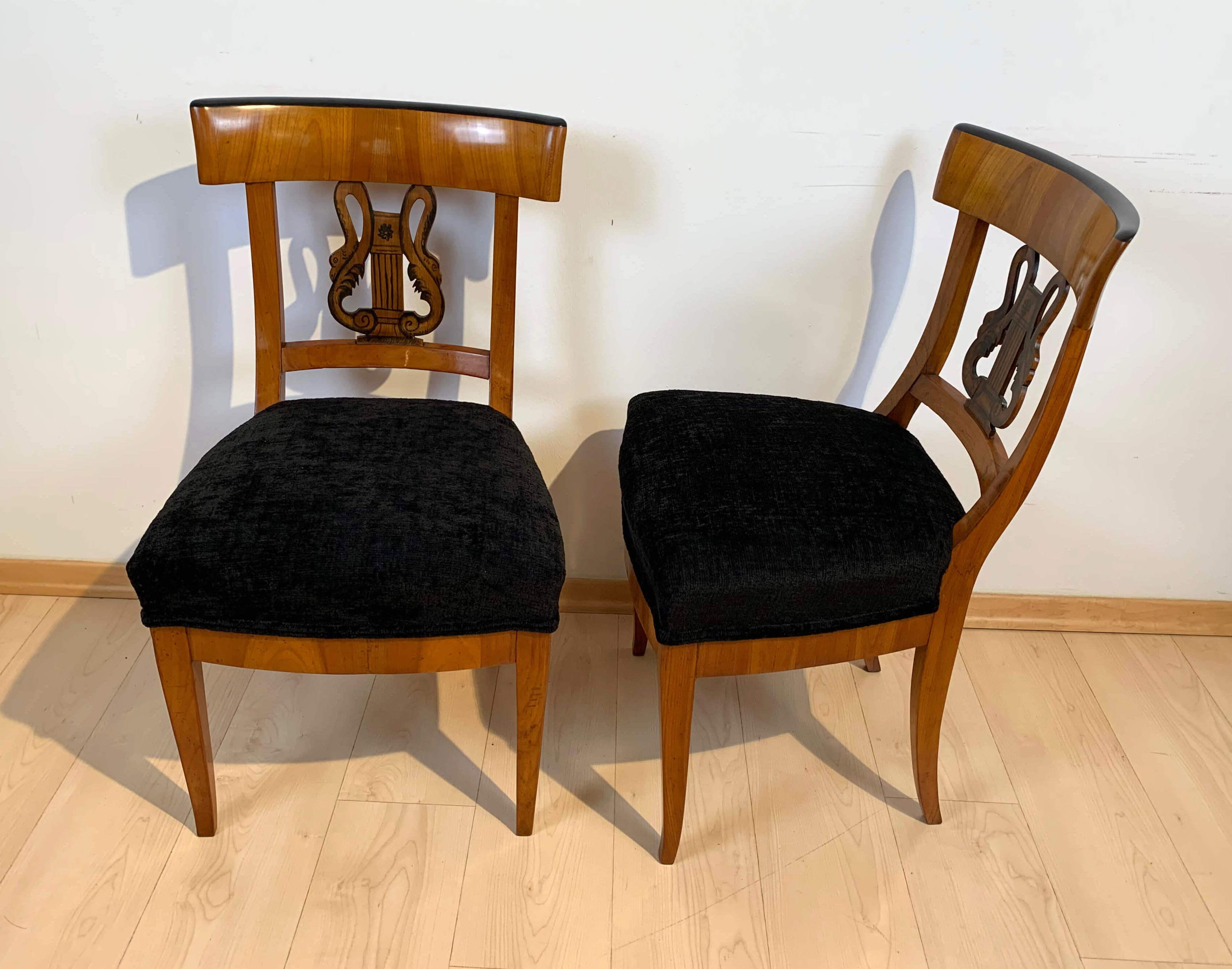 Rare Pair of early neoclassical Biedermeier chairs with amazing painted back decor.

Cherry veneer and solid wood. Refinished with shellac french polish. Very elegant design and back decoration in lyre and swan form with painting and old