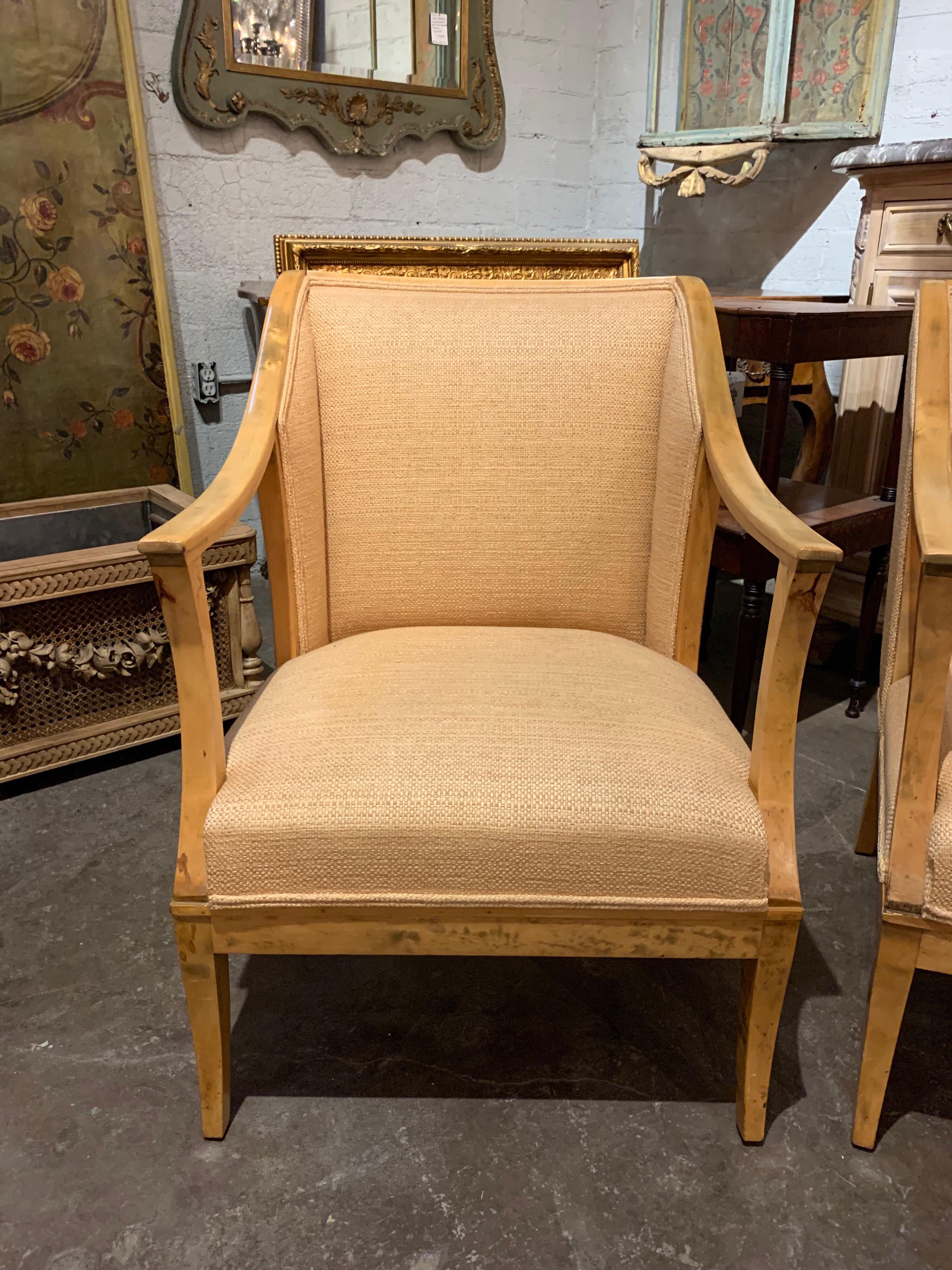 Beautiful pair of Biedermeier rock maple armchairs. The chairs are upholstered in a very fine woven gold colored fabric. A classic style that could be mixed with a variety of decors. Comfortable as well!