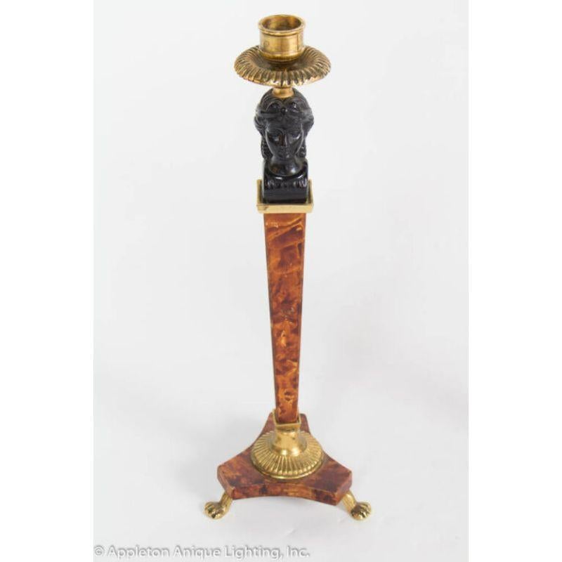 Pair of Biedermeier style candlesticks. Black resin busts, Faux walnut and bronze stems and bases.

Material: wood, brass
Style: Biedermeier, Neoclassical
Period made: Mid 20th Century 
Dimensions: 6 × 6 × 14 in
Condition details: excellent