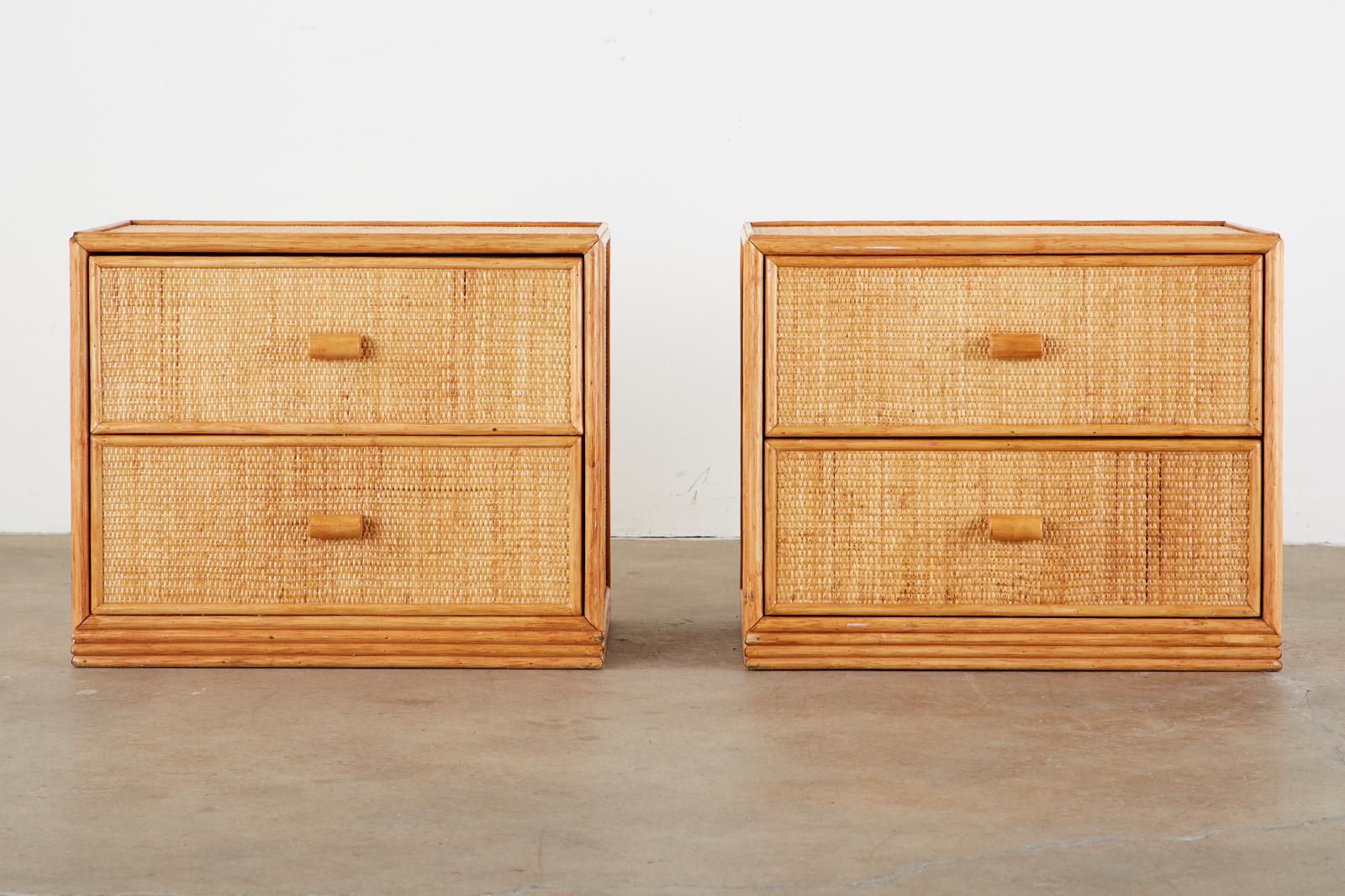Gorgeous pair organic modern nightstands attributed to Bielecky Brothers. The matched pair feature a veneer of woven cane raffia on three sides and top. Fronted by two large storage drawers with wood pulls. The cases have molded wood trim on the