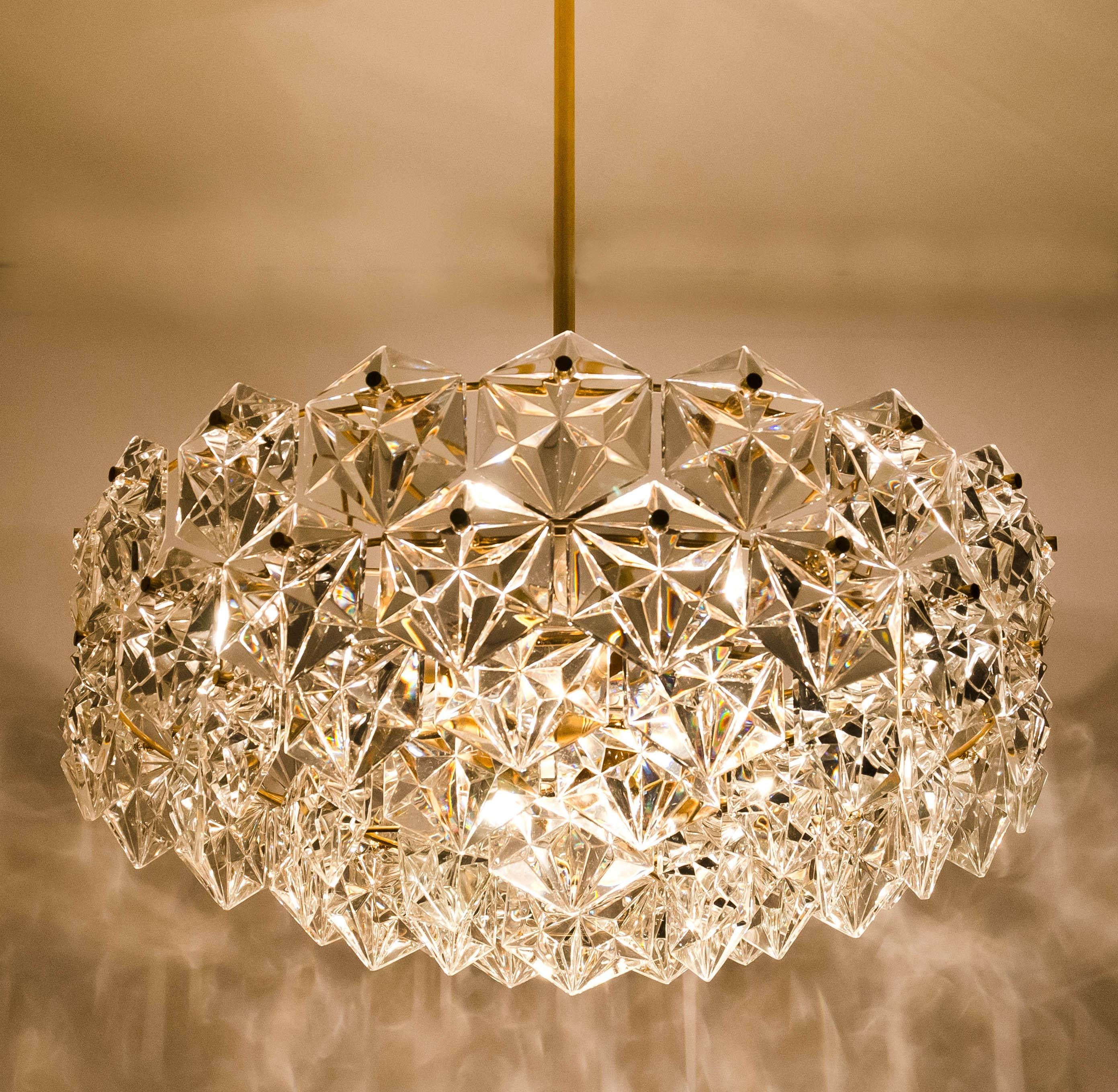 This modernist design chandeliers were designed by the Kinkeldey design team during the 1970s, and manufactured in Germany. A very elegant Kinkeldey chandelier, it is comfortable with all decor periods. The crystals are meticulously cut in such a
