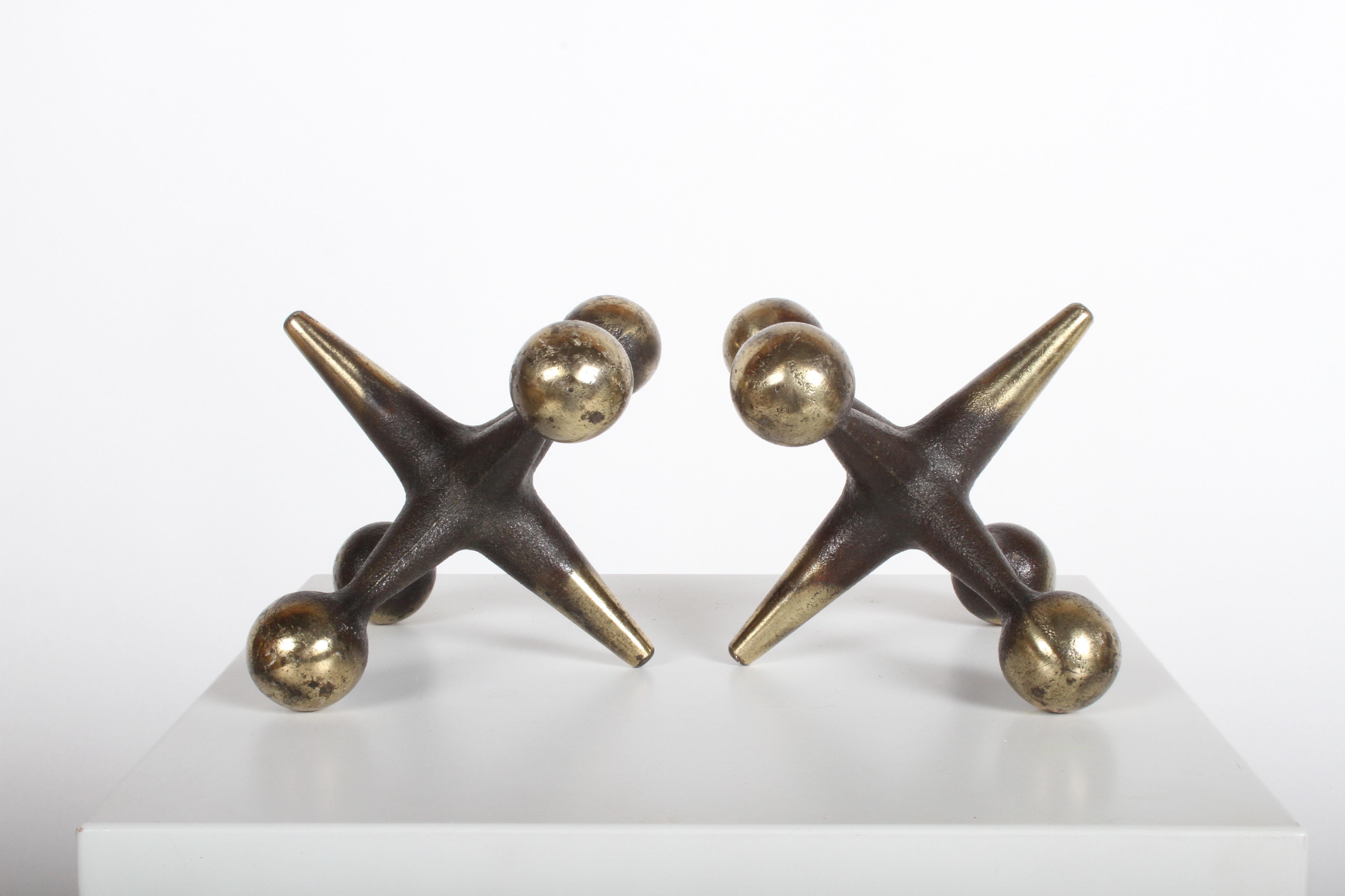 Bill Curry designed iron jacks bookends or decorative objects. Often attributed to George Nelson, these are all original, black with brass ends.