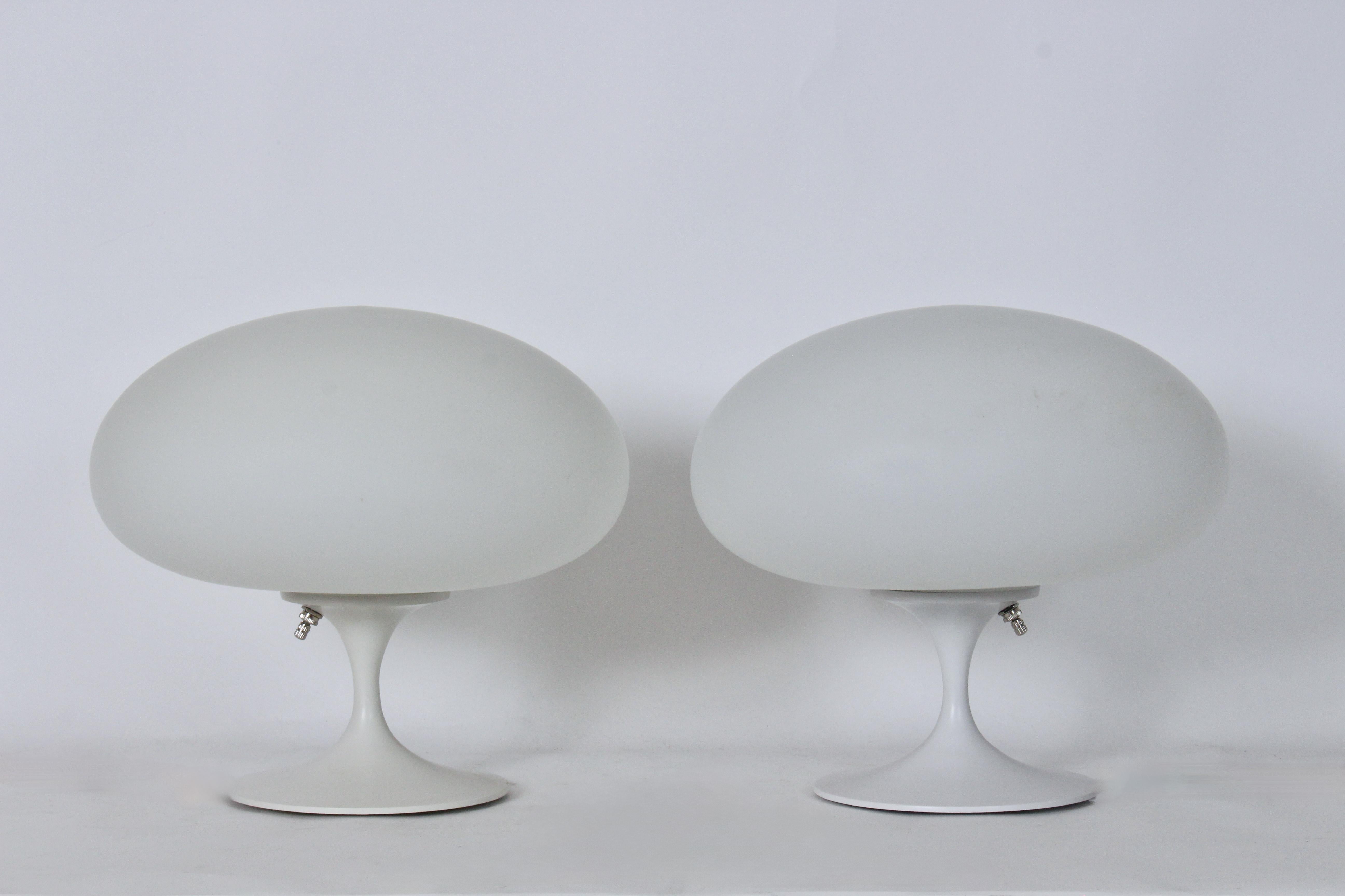 Pair of Bill Curry Design Line for Laurel Lamp Company Mushroom Series Table Lamps. Featuring Off White enameled metal tubular stem, round 7D tulip base and original (6.5H) white frosted glass globes (12.5D x 6.5H). Measures 5.5H to top of rim.