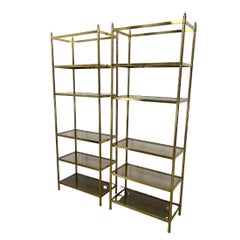 Pair of Billy Baldwin Style Brass Etageres With Smoked Glass Shelves