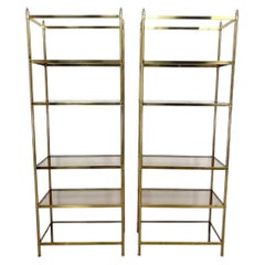 Pair of Billy Baldwin Style Brass Etageres With Smoked Glass Shelves
