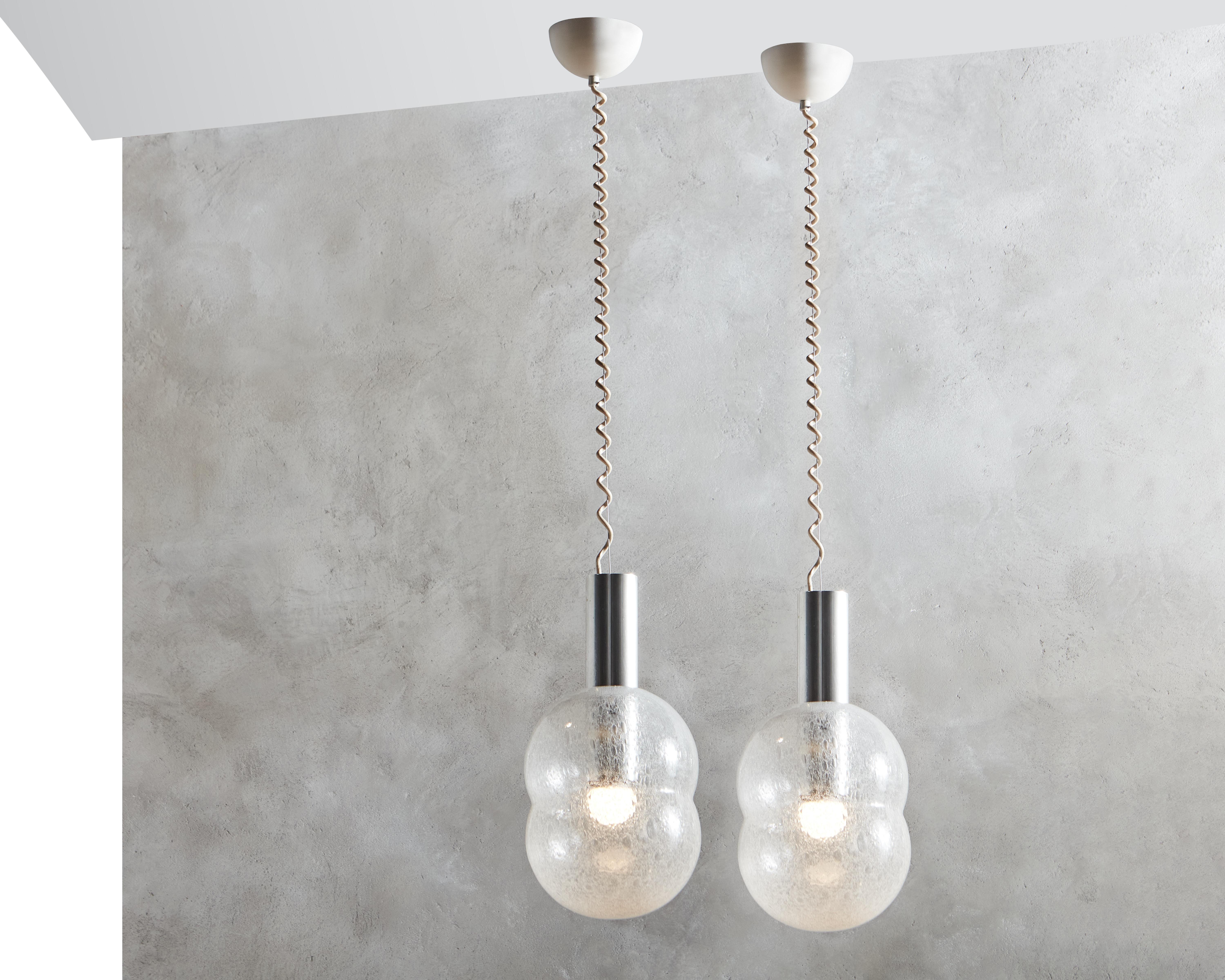 Rare set of two “Bilobo” Pendant lamps by Tobia Scarpa for Flos. Pendant lamps, giving diffused light, fitted with metalized glass diffuser. Anodized aluminium support with a spring loaded device for removal of the glass diffuser. “The model come