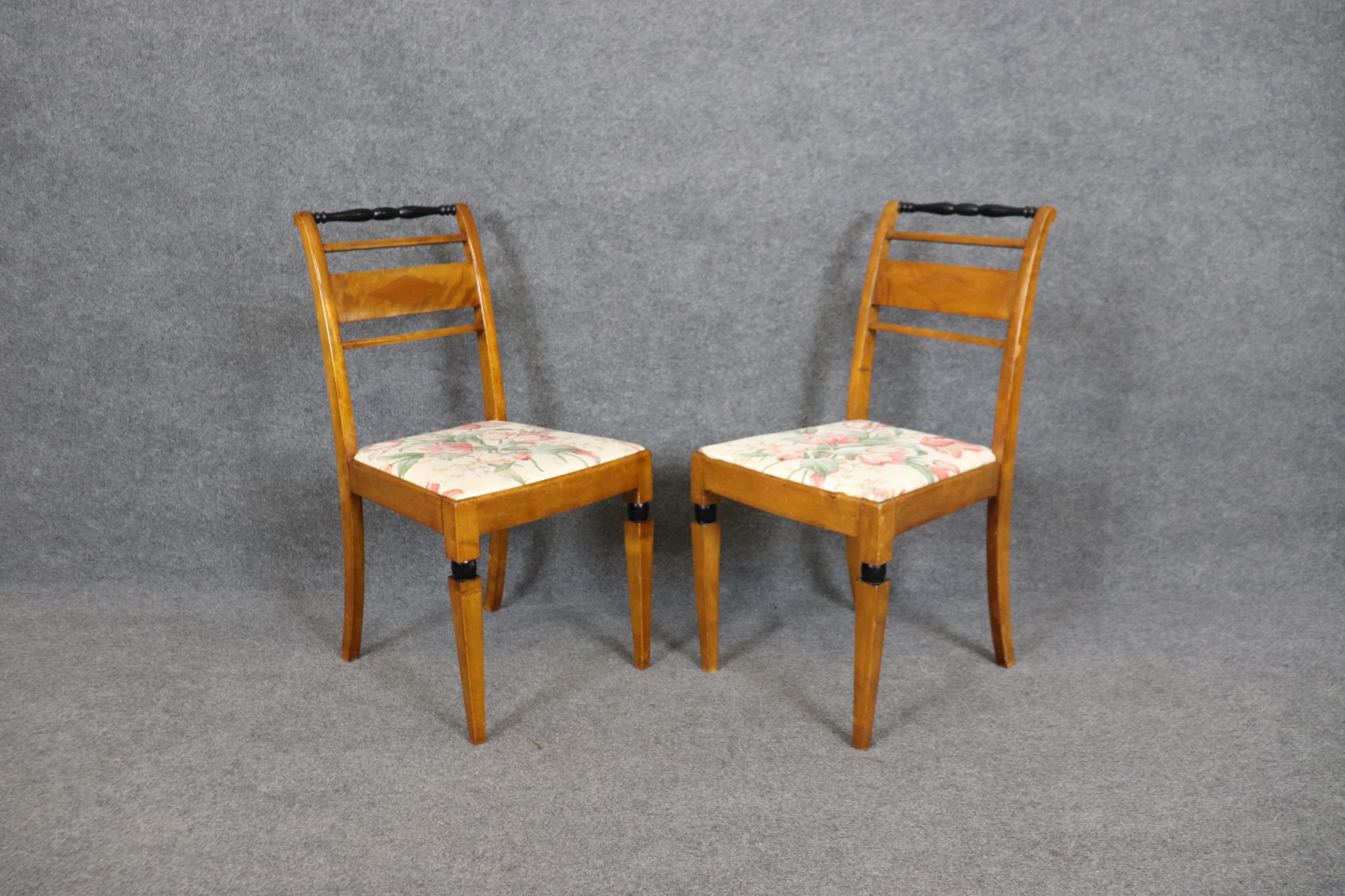 This is a fine pair of Biedermeier style chairs made during the 1900-1920s era in most likely Germany. The chairs are in good condition and will show losses and signs of age and use that are indicative of age. Measures 35.5 tall x 18 wide x 21 deep