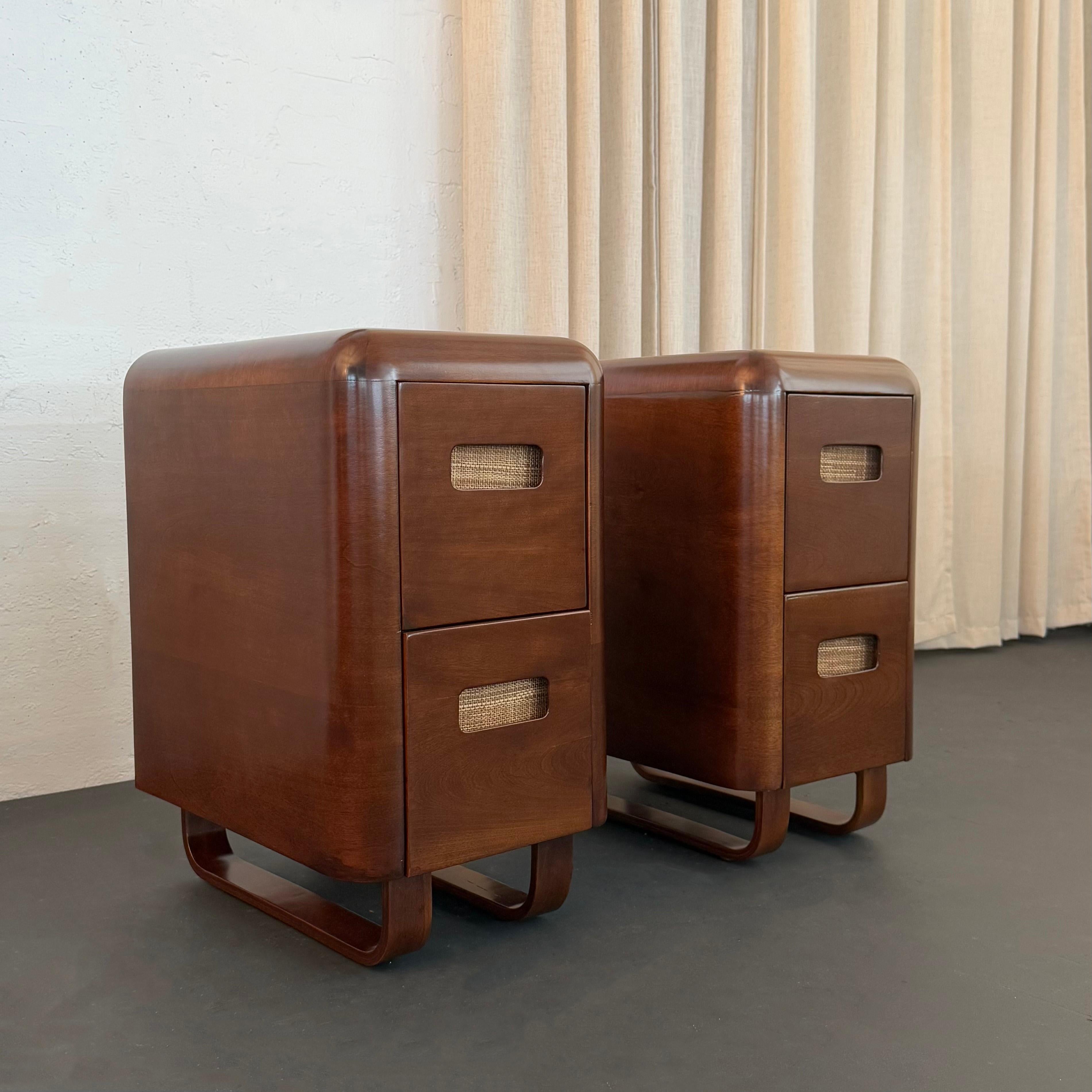 This pair of streamlined Art Deco bentwood night stands were designed by Paul Goldman for Plymodern circa 1940s. These slim, two-drawer, birch wood night stands feature Goldman's signature bullnose edges with recessed drawer pulls and open bentwood