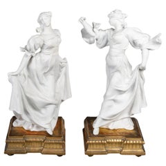 Vintage Pair of Biscuit Sculptures, 1900, on an Attractive Gilded Carved Wood Base.