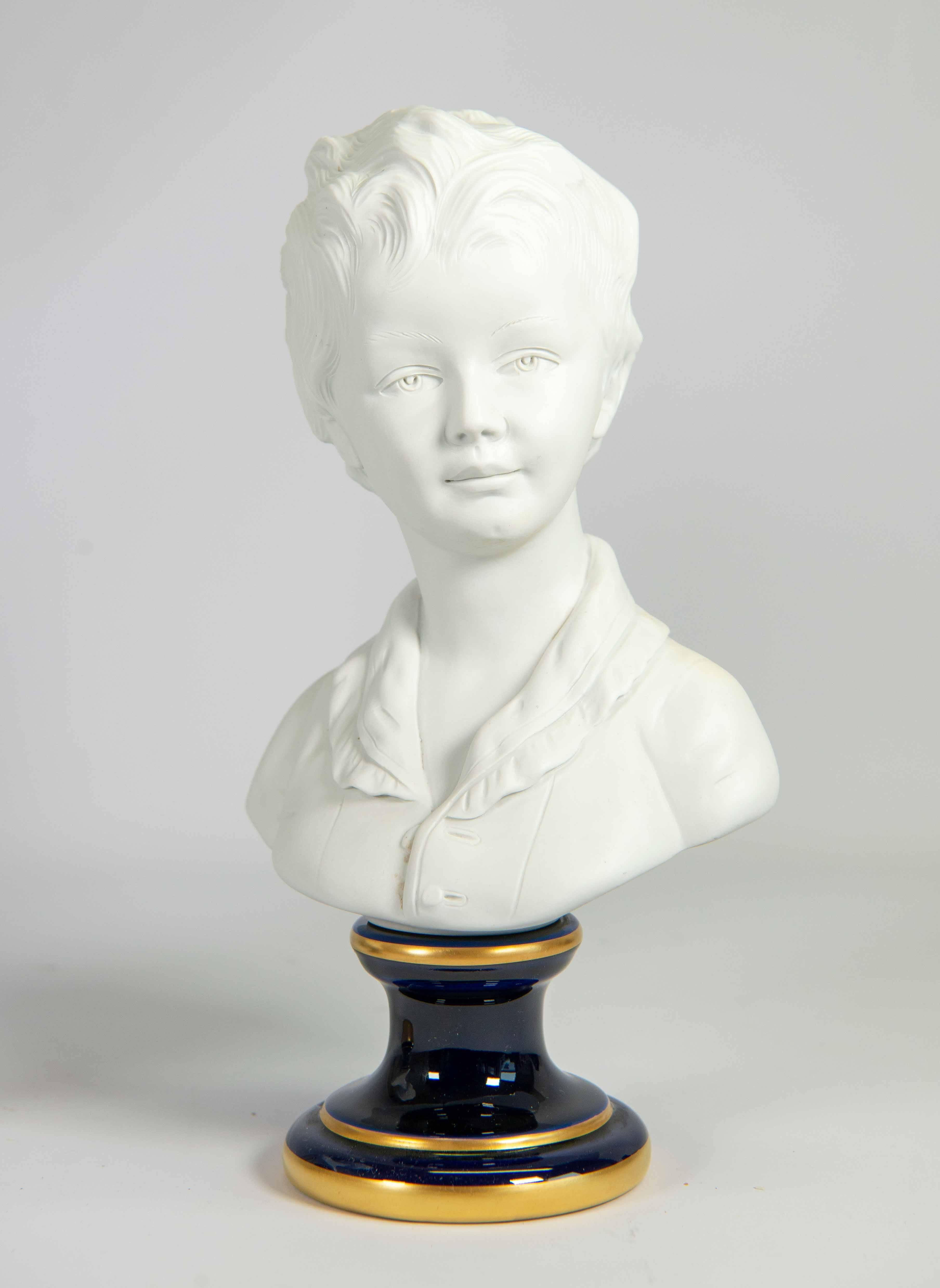 Pair of signed busts made of biscuit porcelain standing on a porcelain base. Signed on base and engraved 'Après Houdon' or After Houdon. The pair of statues is Louise and Alexandre Brongniart. They are the children of Alexandre The´odore Brongniart