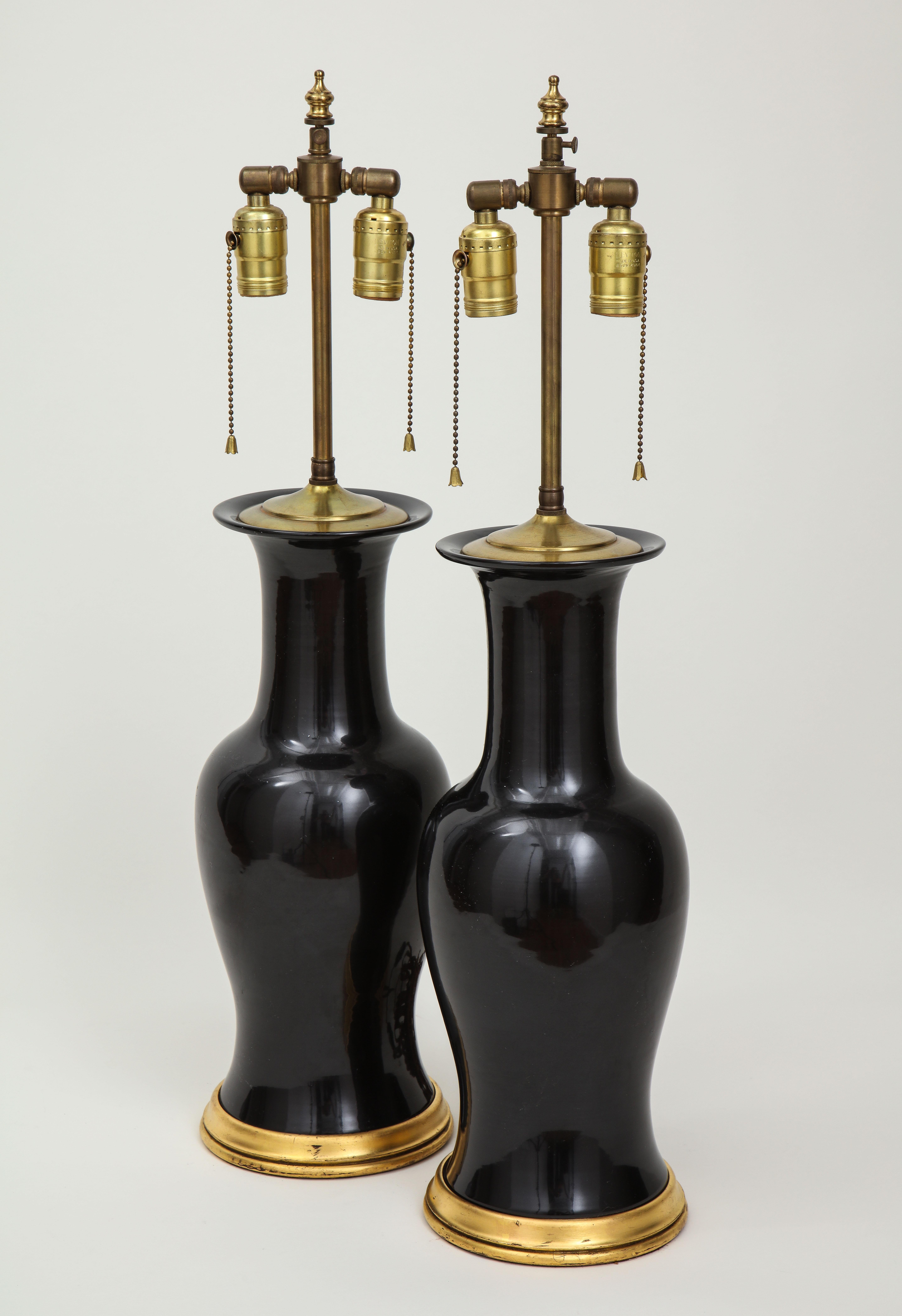 Pair of Black and Gilt Ceramic Vase Lamps 1
