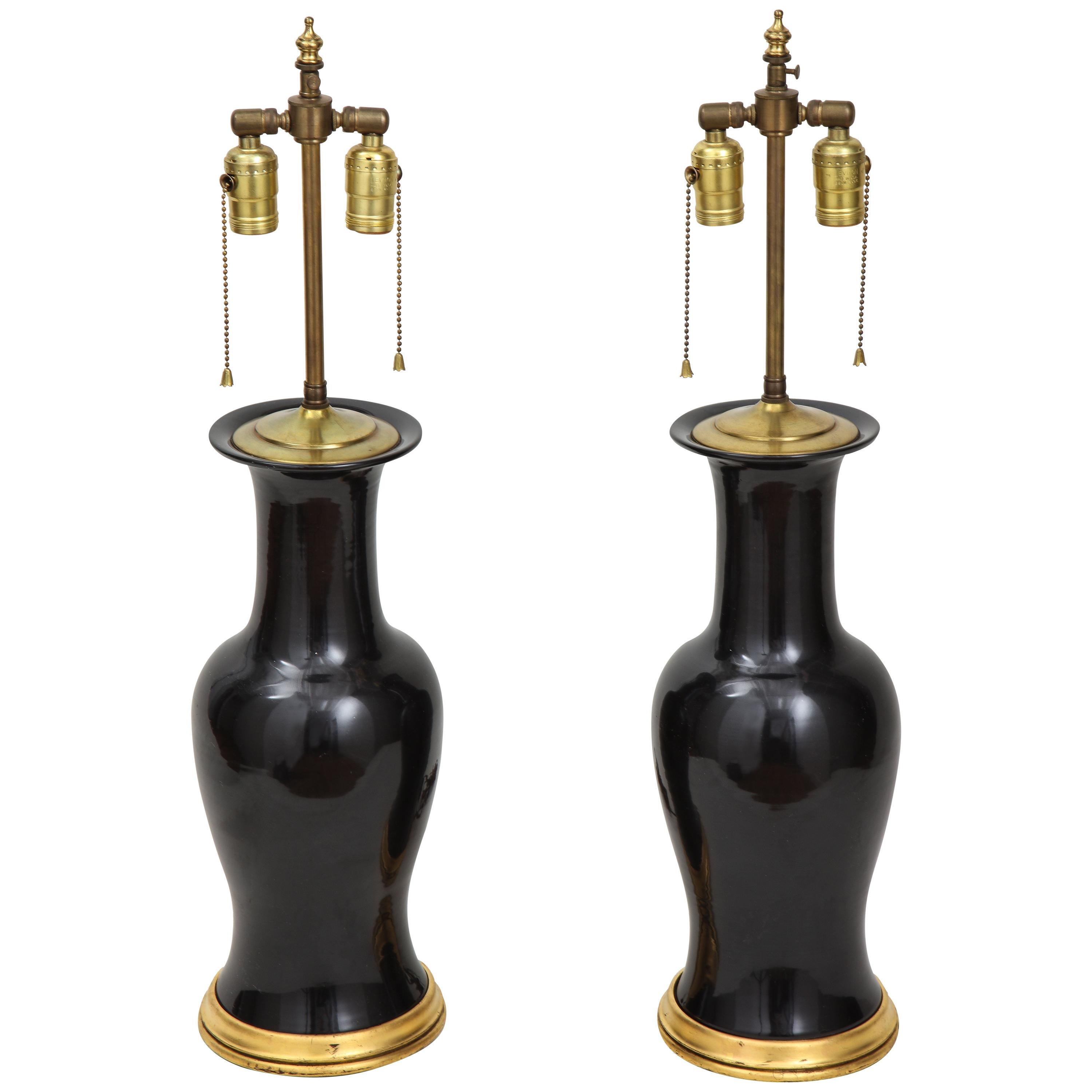Pair of Black and Gilt Ceramic Vase Lamps