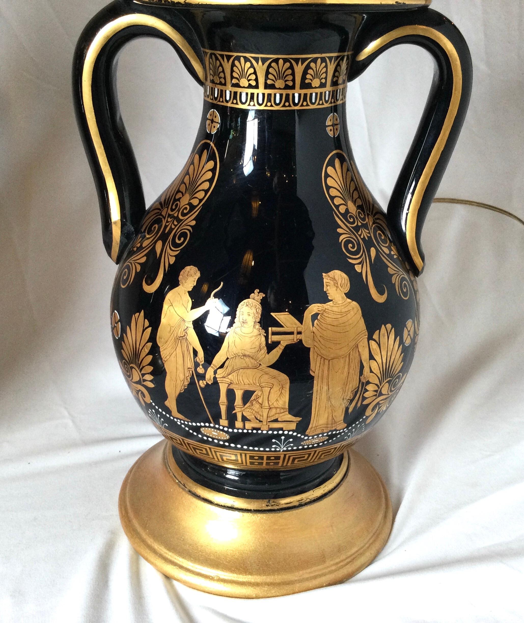 Pair of Black and Gilt Neoclassical Urn Lamps In Excellent Condition For Sale In Lambertville, NJ