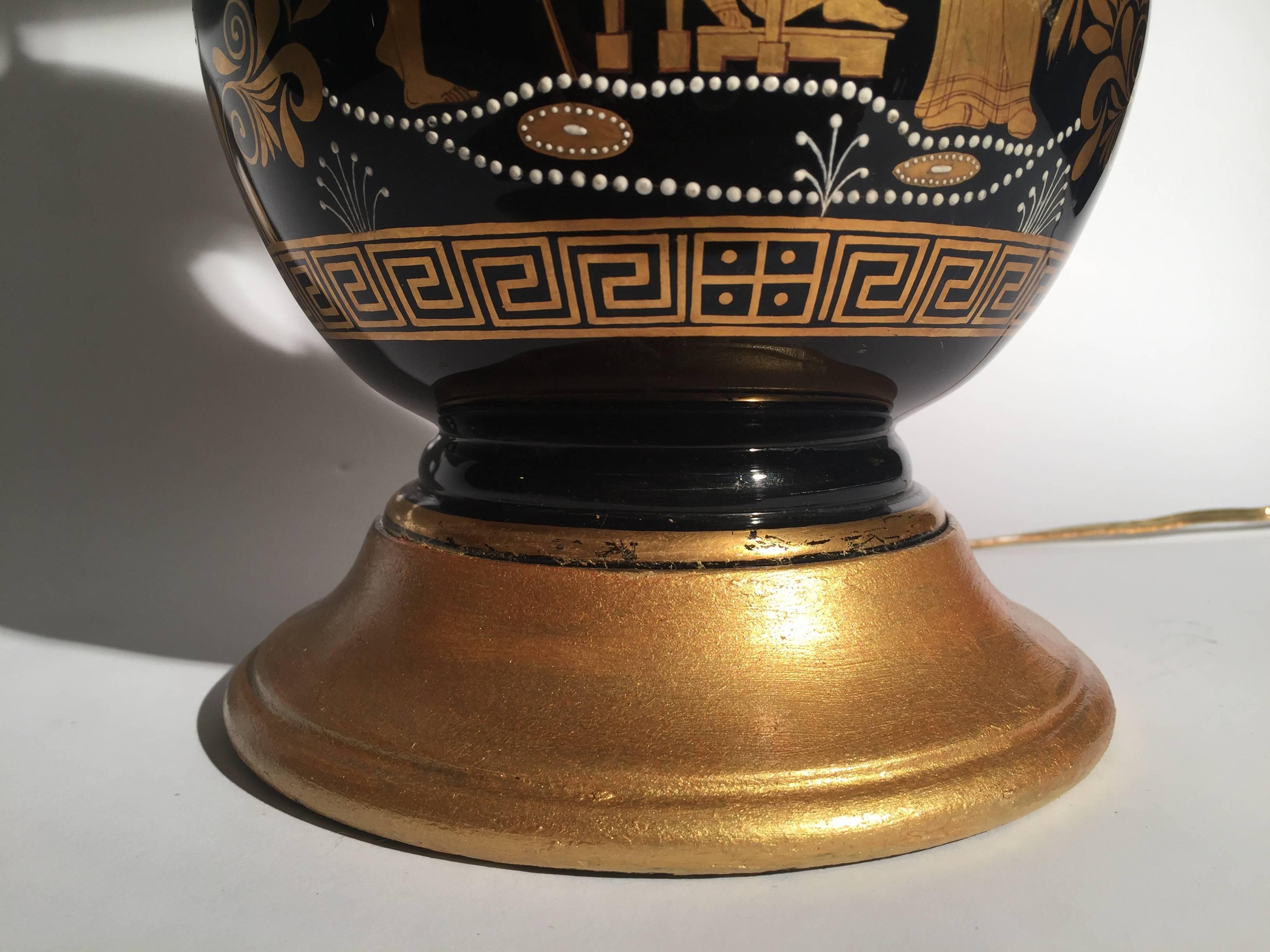 Pair of Black and Gilt Neoclassical Urn Lamps In Excellent Condition In Lambertville, NJ
