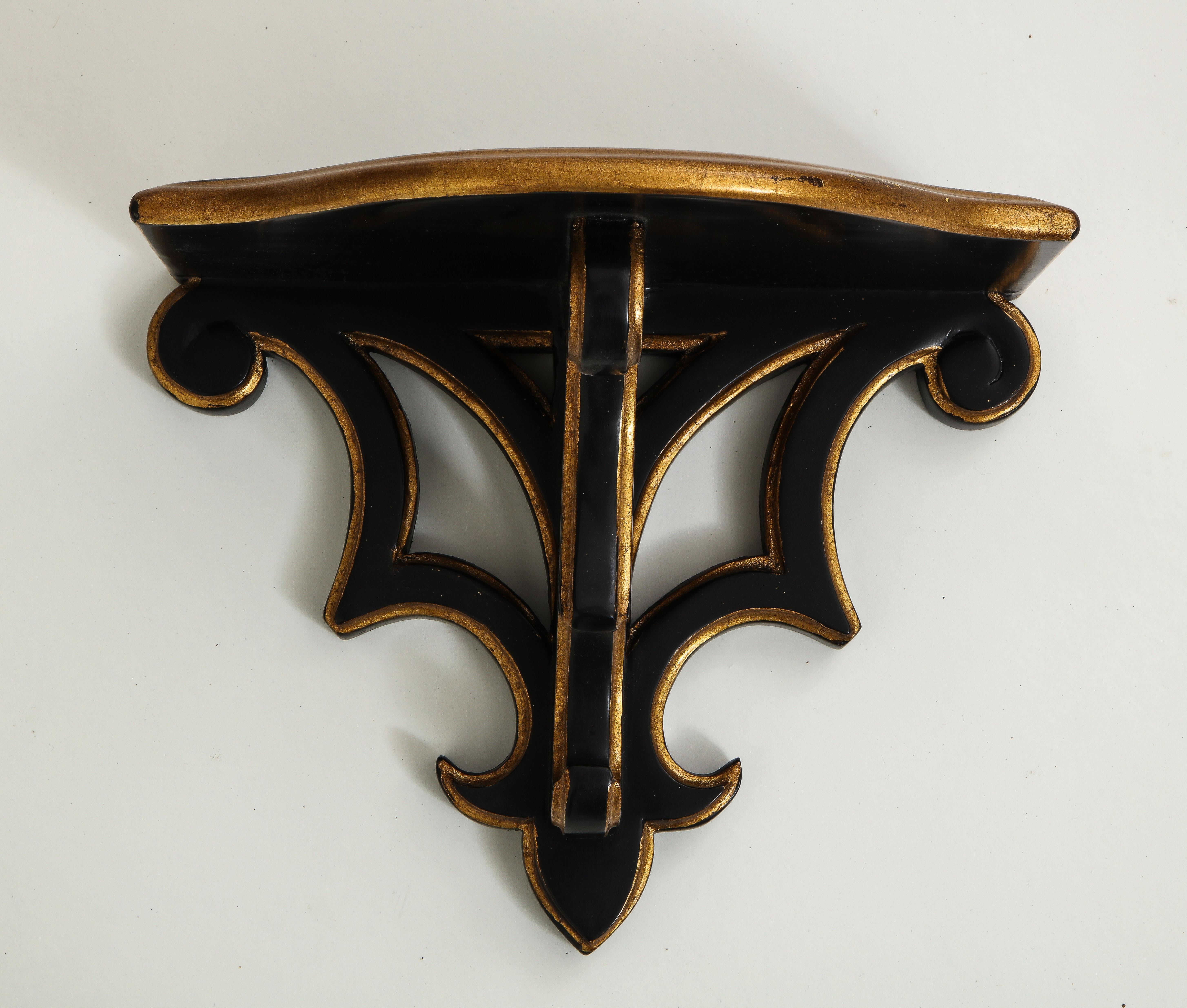 Wood Pair of Black and Gilt Wall Brackets