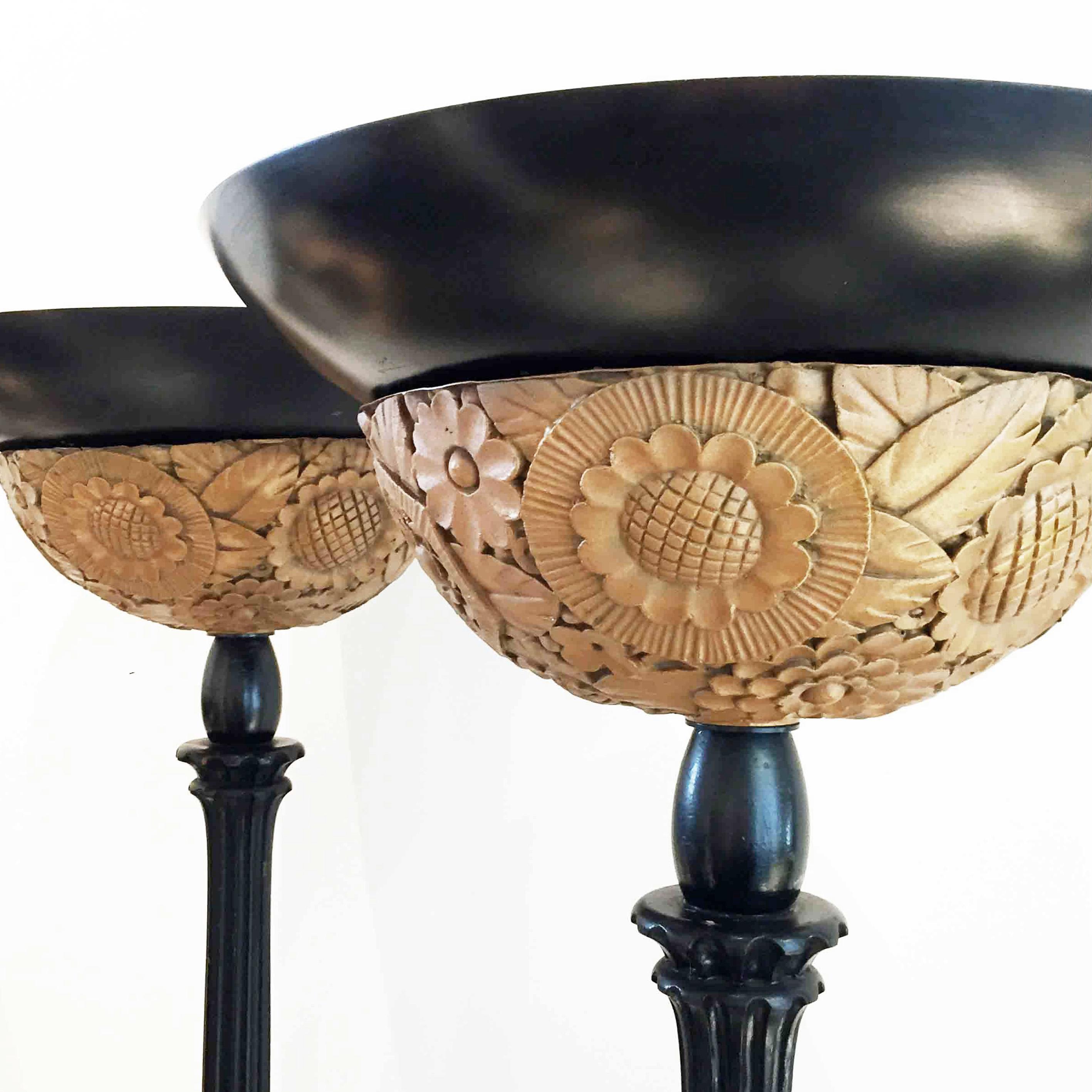 French Pair of Black and Gold Art Deco Floor Lamps, Featuring Carved Decorative Bases For Sale
