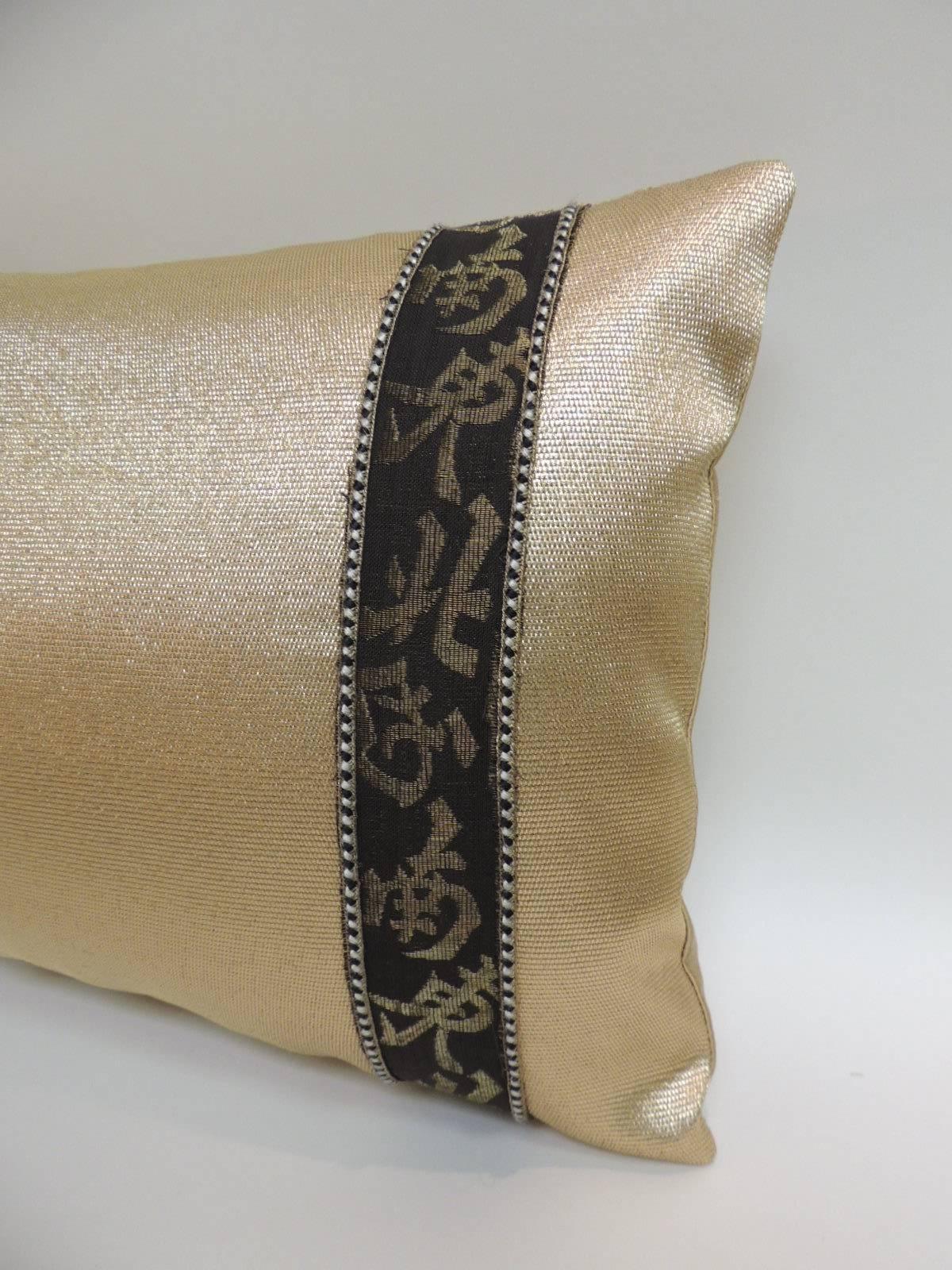 Vintage gold and black Obi textile lumbar decorative pillows embellished with vintage woven Chinese trims and framed with small gold, black and silver decorative trims. Trims inspired by the old Chinese calligraphy and backed by golden silk
